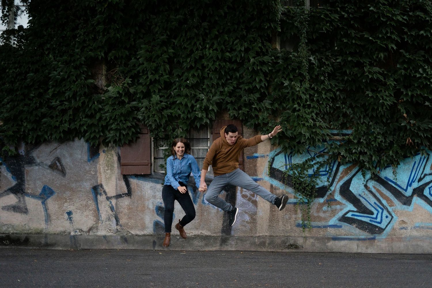 Progressive sequence showing two people posing playfully against a graffiti wall.