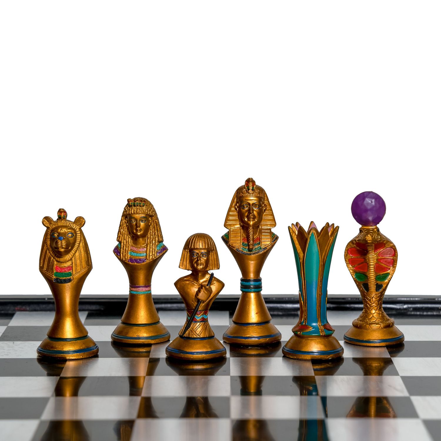 Golden Egyptian-themed chess pieces arranged in row showing detailed hieroglyphic designs.