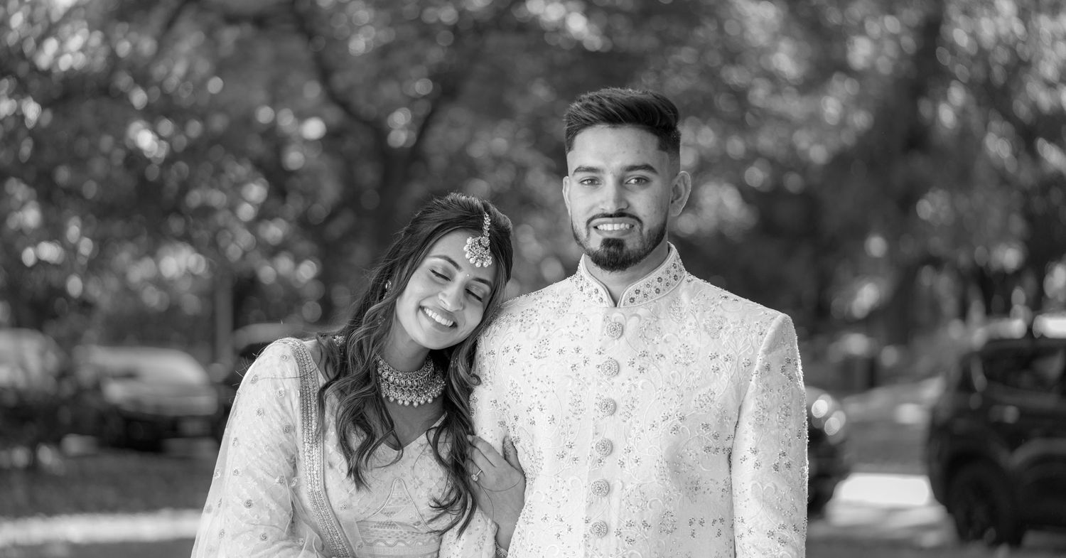 Black and white portrait session in a natural outdoor setting.