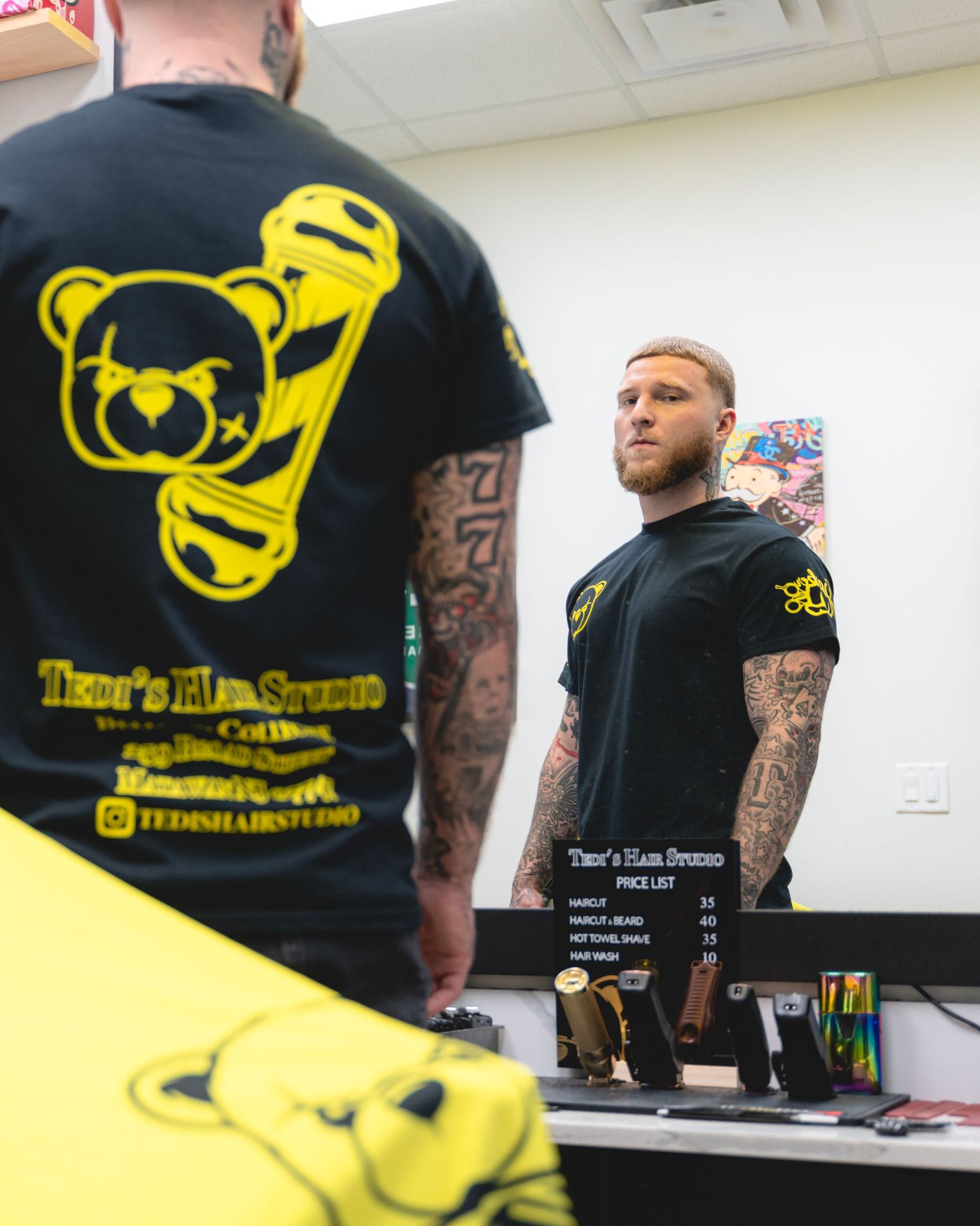 Seven t-shirt designs featuring a yellow teddy bear logo and tattoo-style graphic prints on black shirts displayed in sequence.