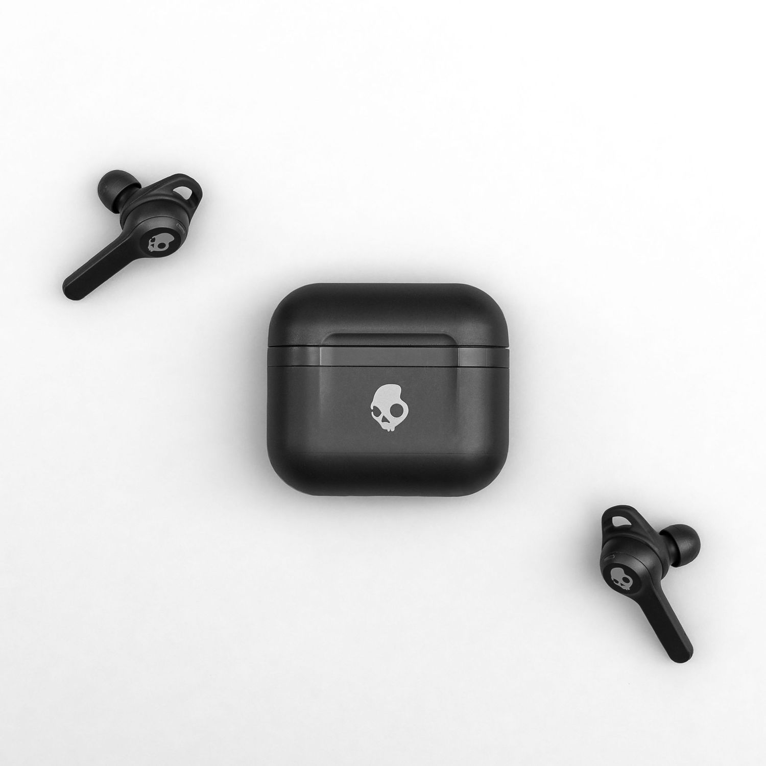 Collection of modern wireless earbuds and charging cases in black arranged on a light gray background.