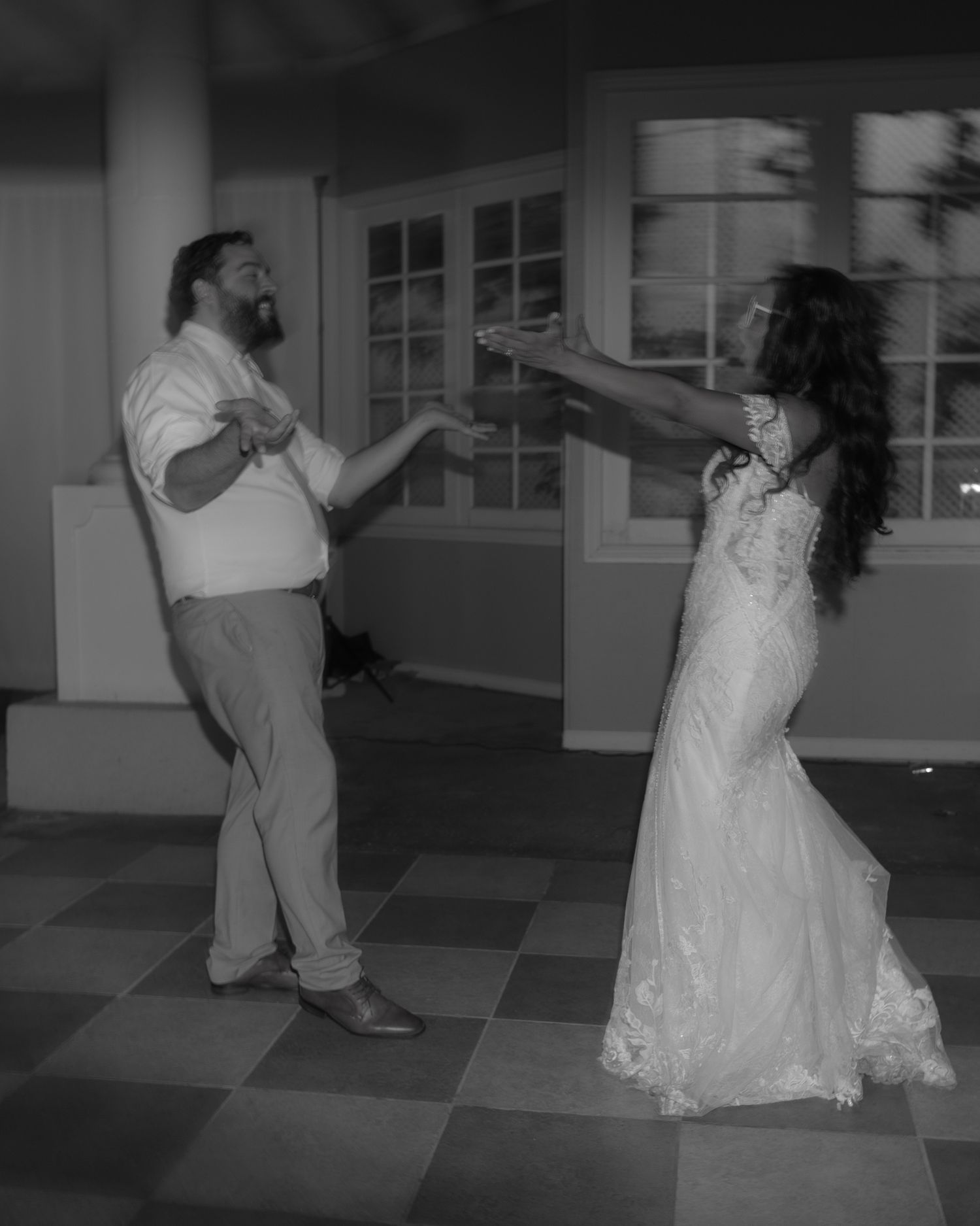 Black and white sequence of a couple dancing at their wedding reception.