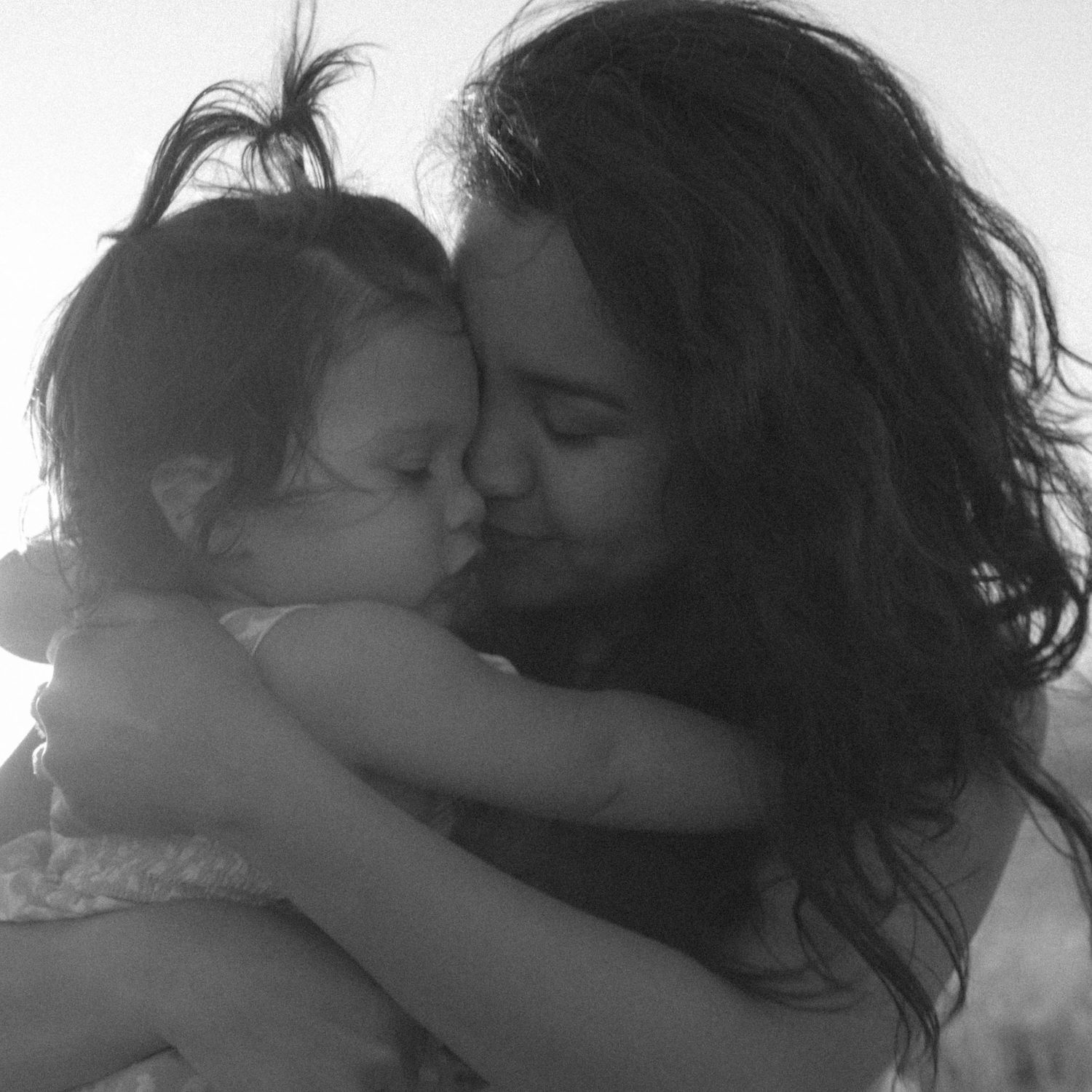 An intimate black and white portrait showing tender affection.
