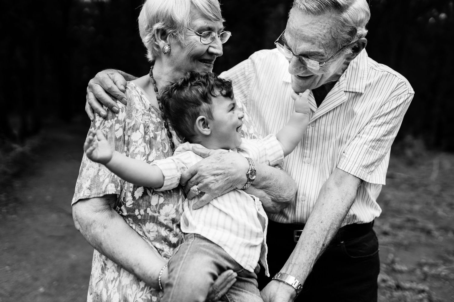 A series of black and white photographs show affectionate moments between a senior couple throughout their life together.