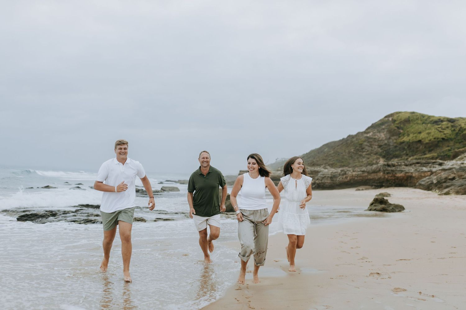 A multi-frame sequence shows people walking and playing at a scenic beach along the coastline.