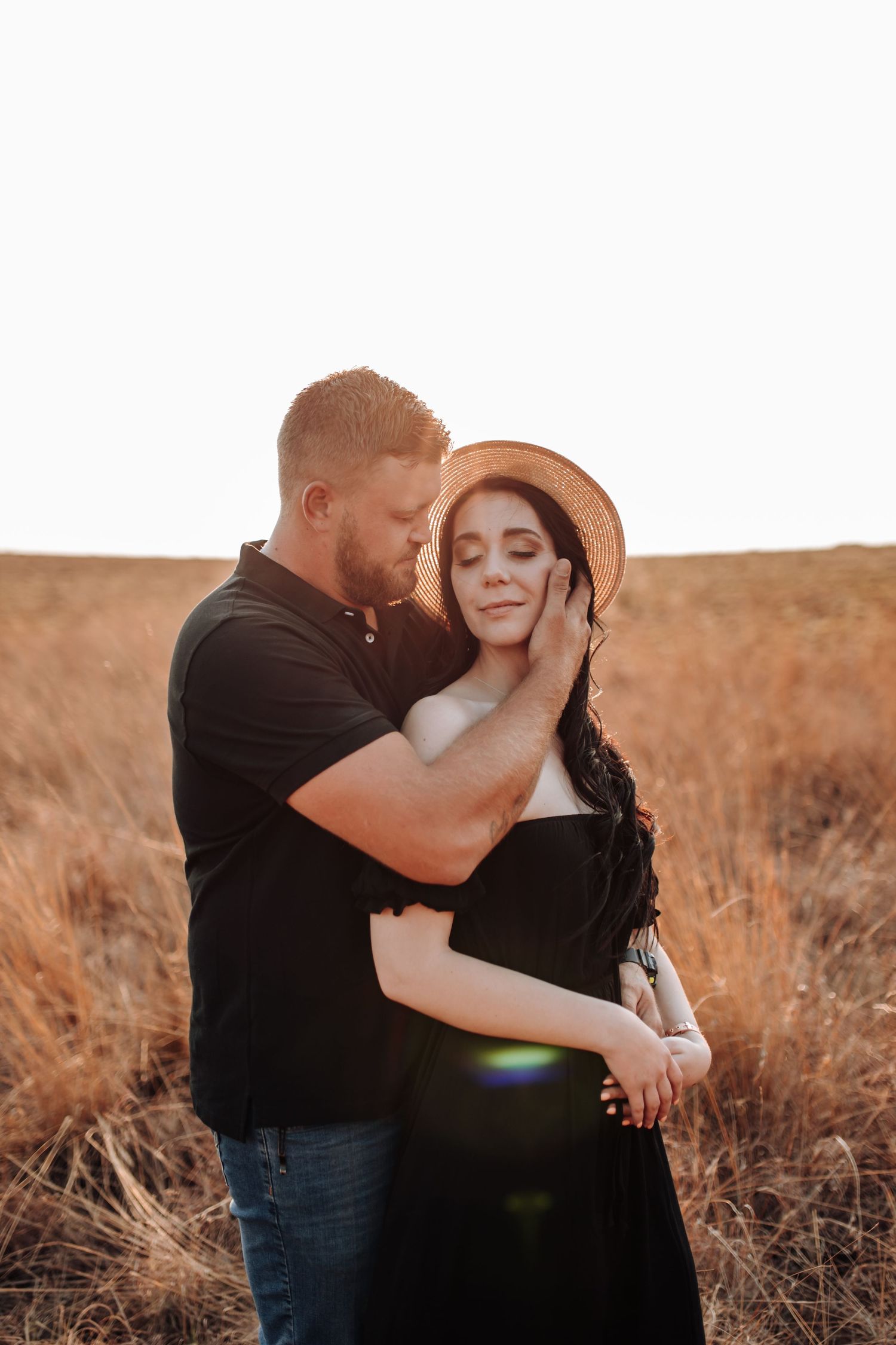 Affectionate couple embraces in warm sunlit field during sunset framed in multiple romantic poses.