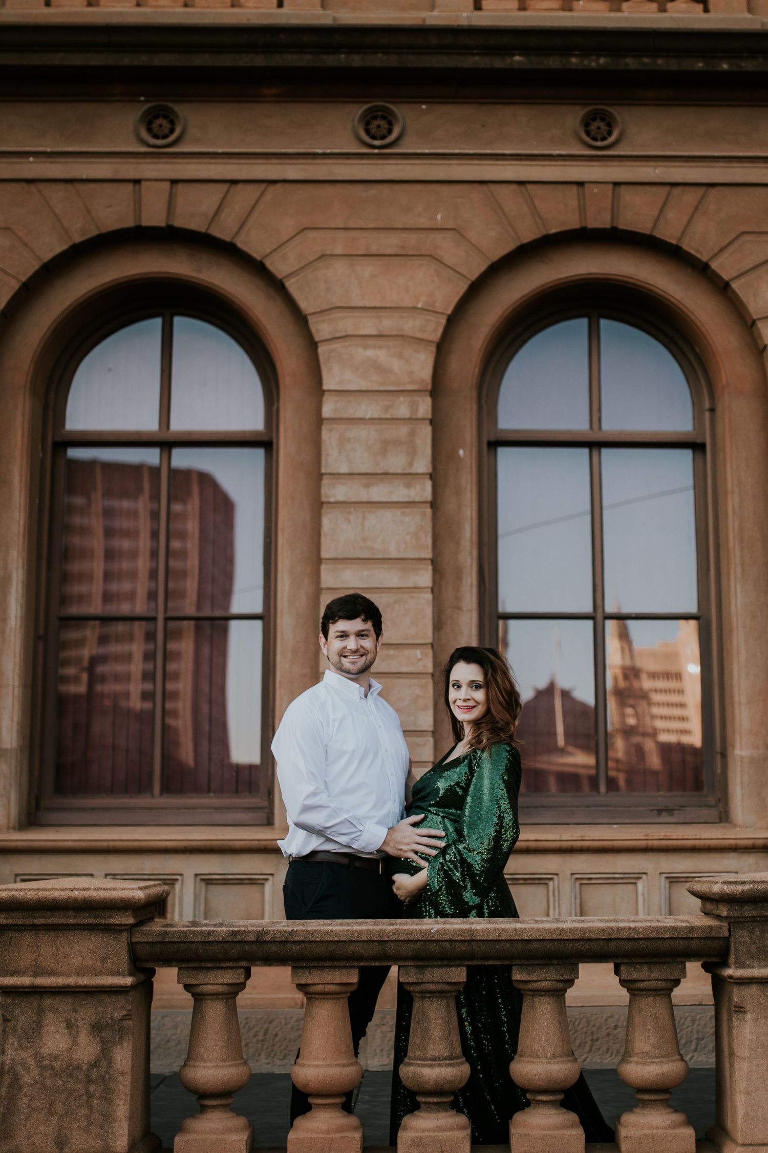An engaged couple poses together against stone architecture in a romantic five-photo collage series.