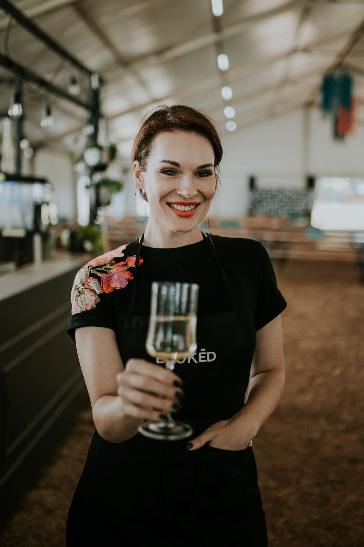 A sequential series of photos showing someone in a black t-shirt holding and enjoying a glass of wine.