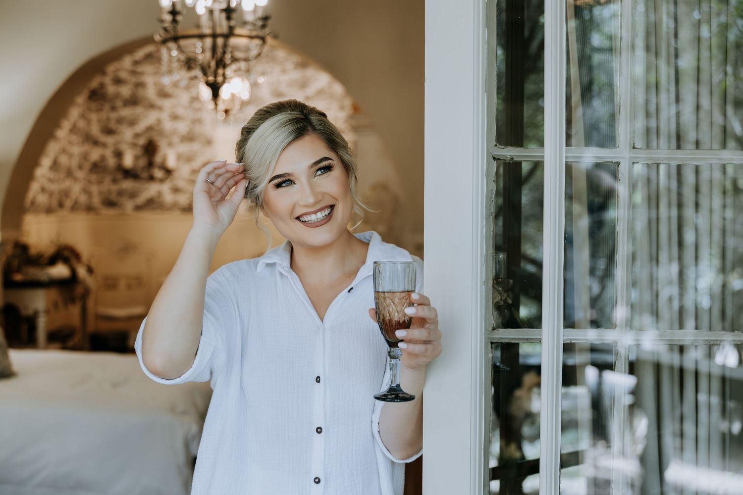 A series of wedding preparation photos showing someone in a white button-down shirt getting ready in a luxurious room setting.