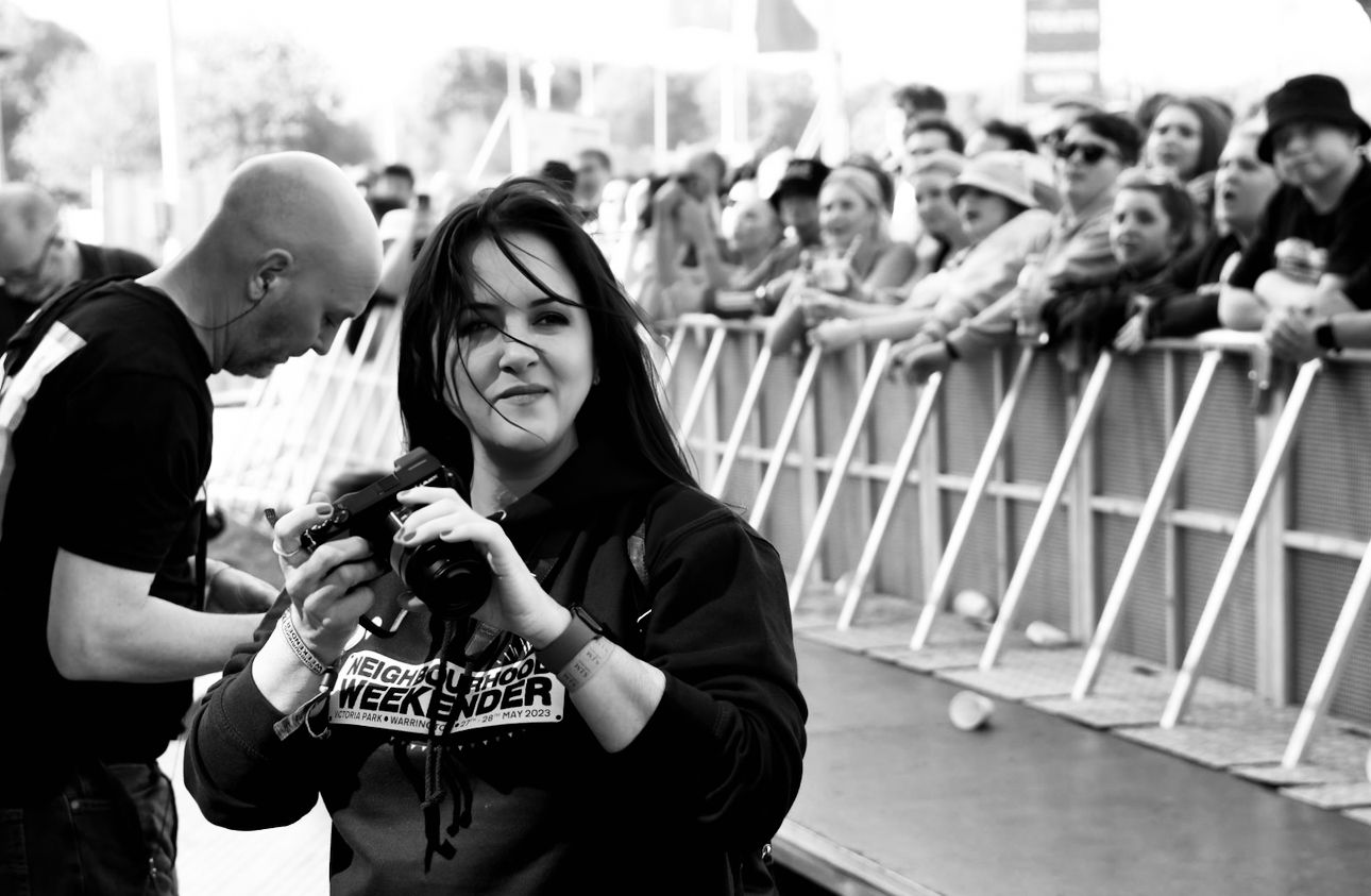 Nat Persoglio photographing a live event at Neighbourhood Weekender festival.