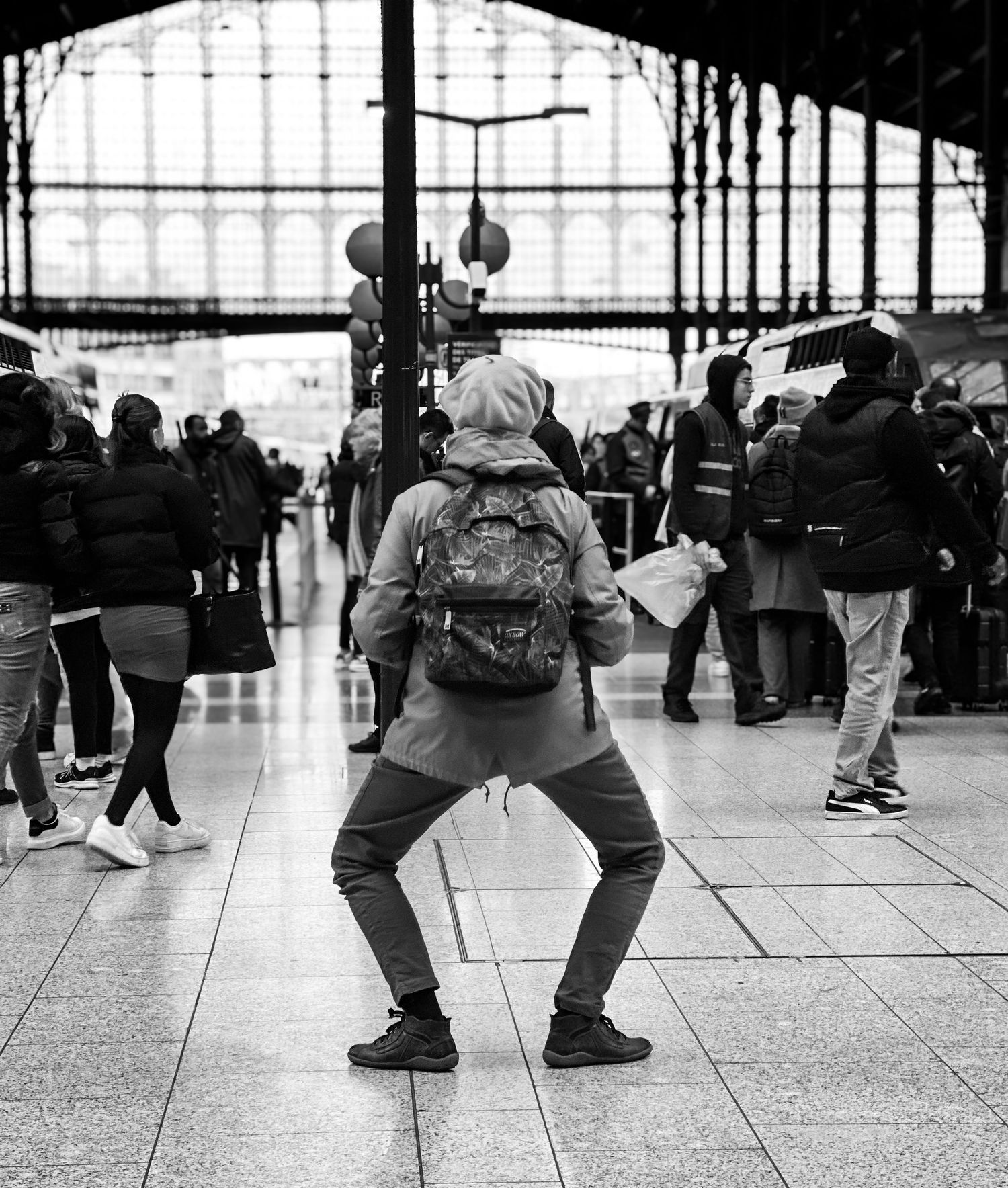 Paris Notre Dame de La Garde station. A lady exercises while waiting for her train.