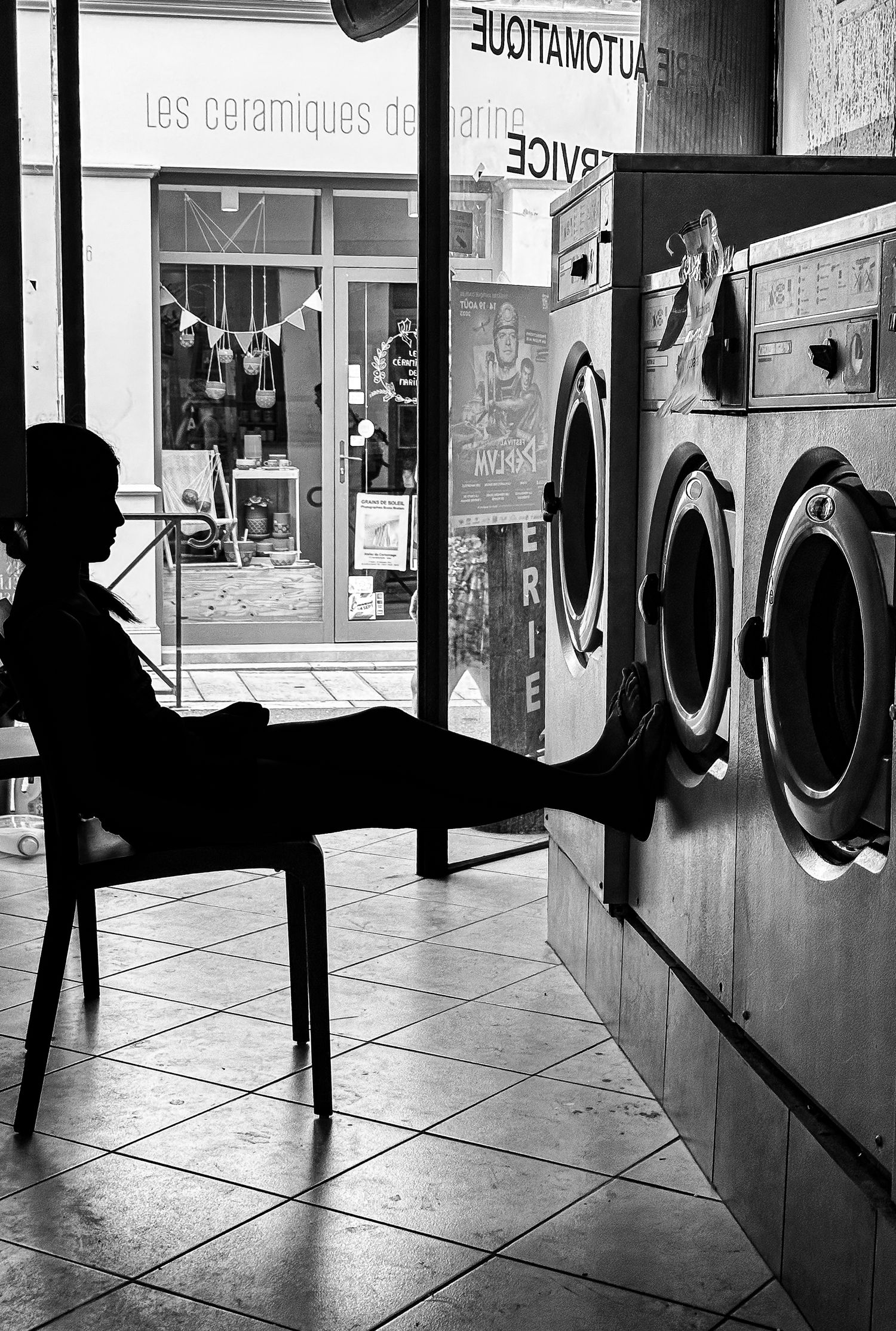 Girl in the laundrette in Arles - second place in The Photography Show's Emerging Artist award.