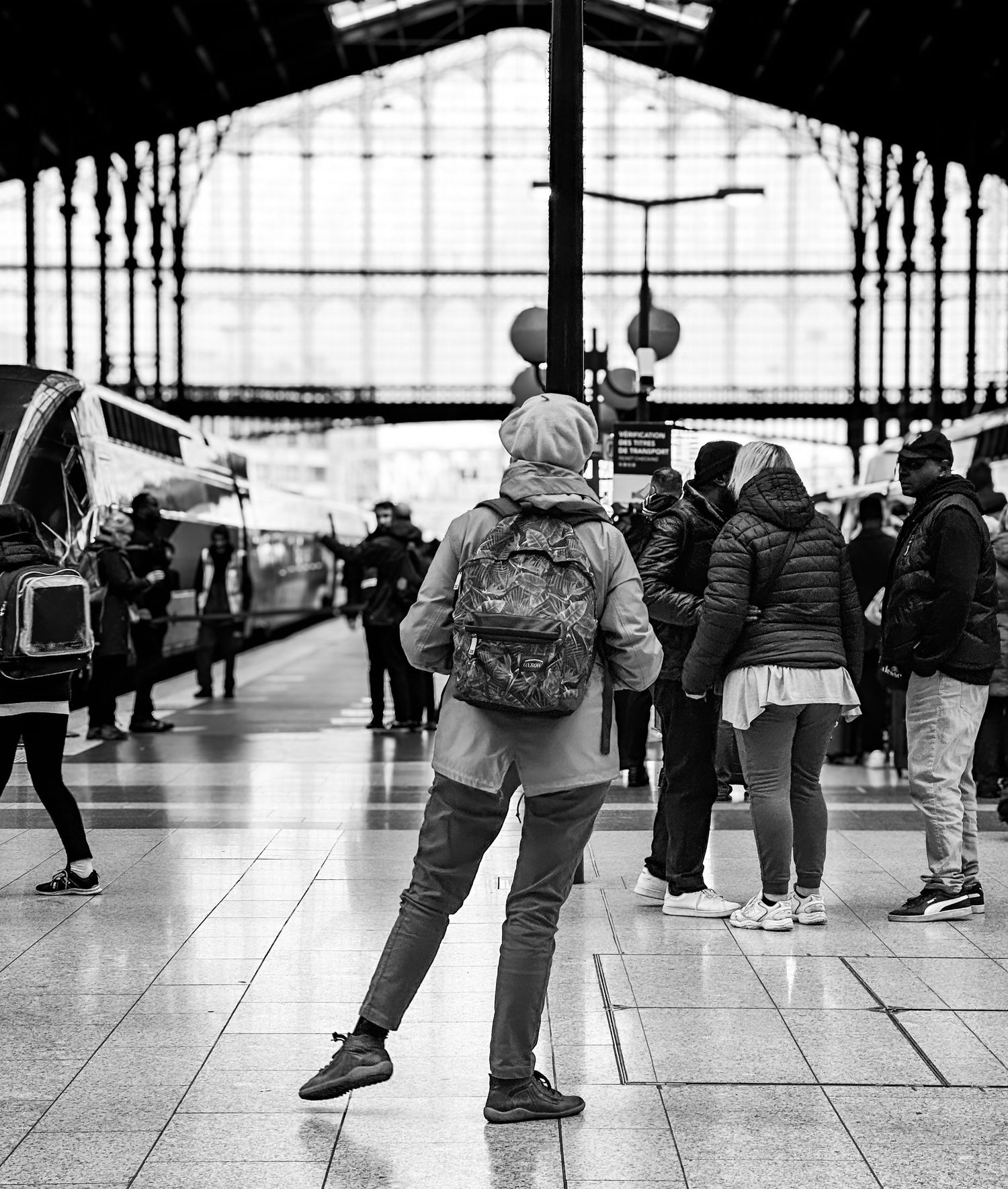 Paris Notre Dame de La Garde station. A lady exercises while waiting for her train.