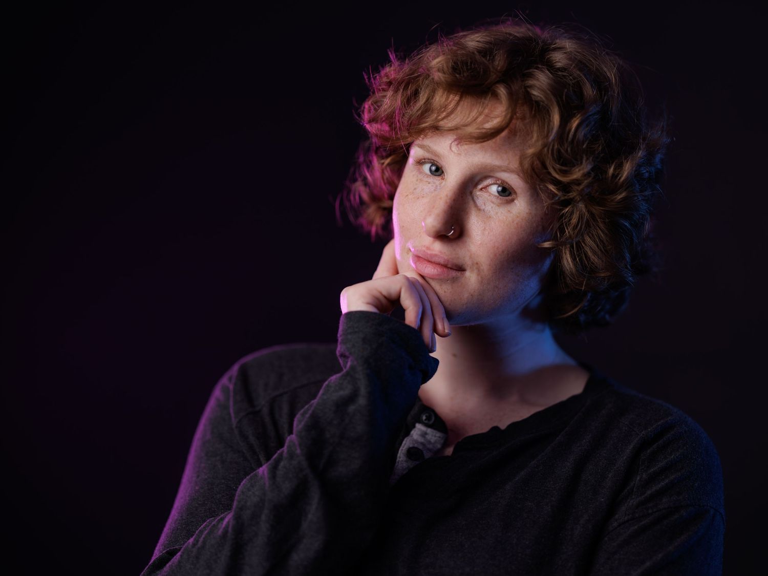 Artistic portrait series with dramatic purple lighting showing contemplative expressions against dark background.