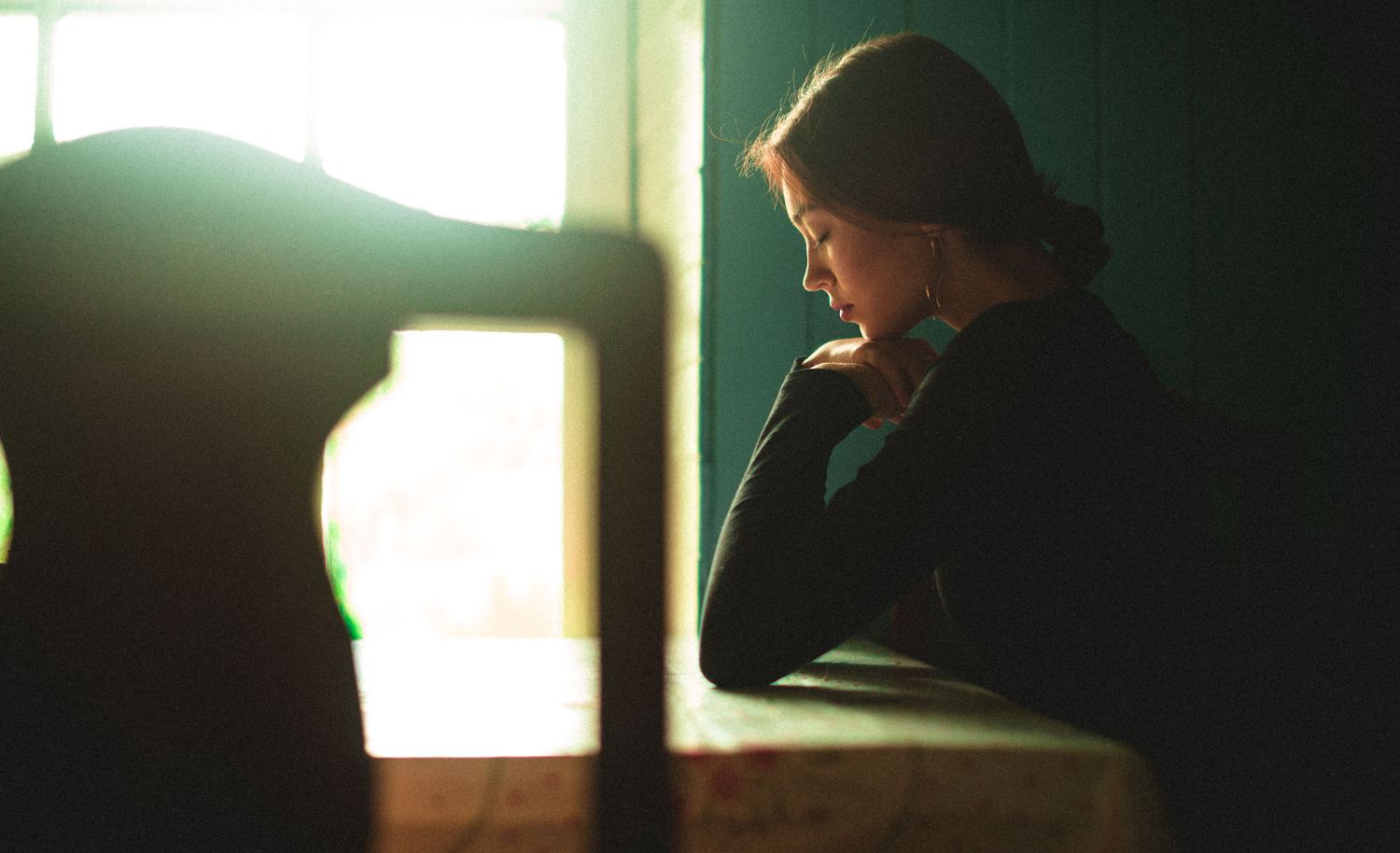 Female portrait highlighting facial profile features and expression, captured with soft natural light.
