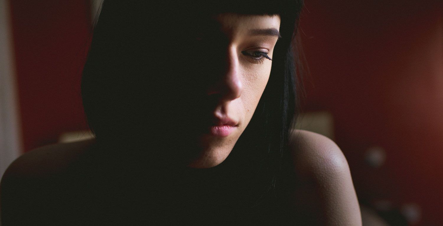 Close-up portrait of a woman with a calm expression, professional portrait photography in Ireland.
