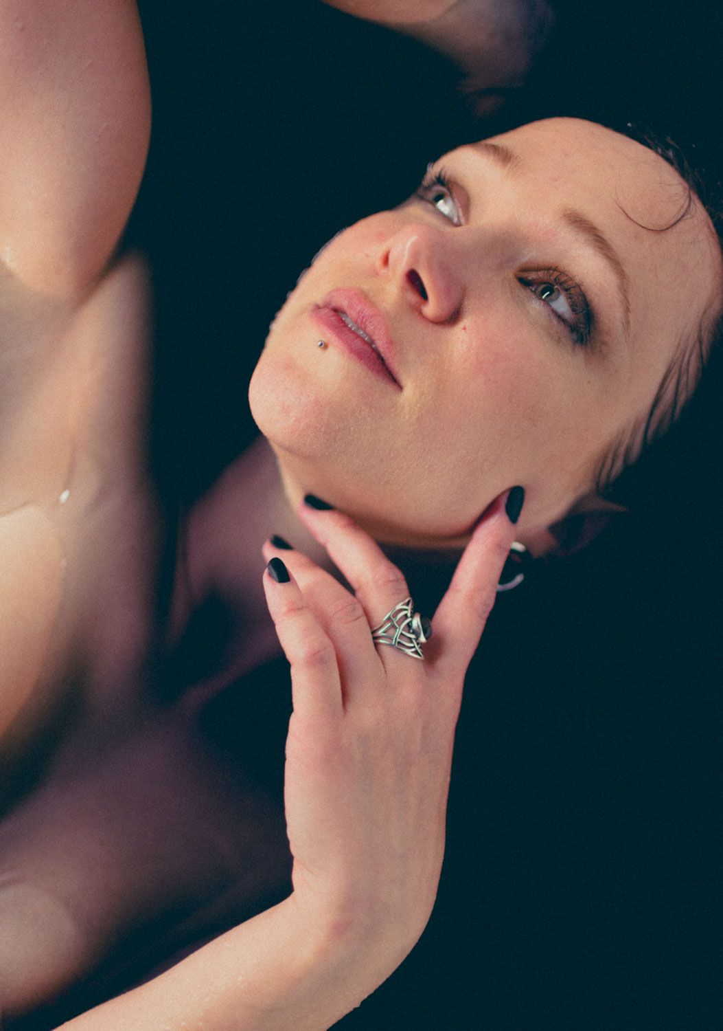 Intimate portrait of a woman in bath tub exuding confidence and elegance, photographed in Cork Ireland by subversePhoto.