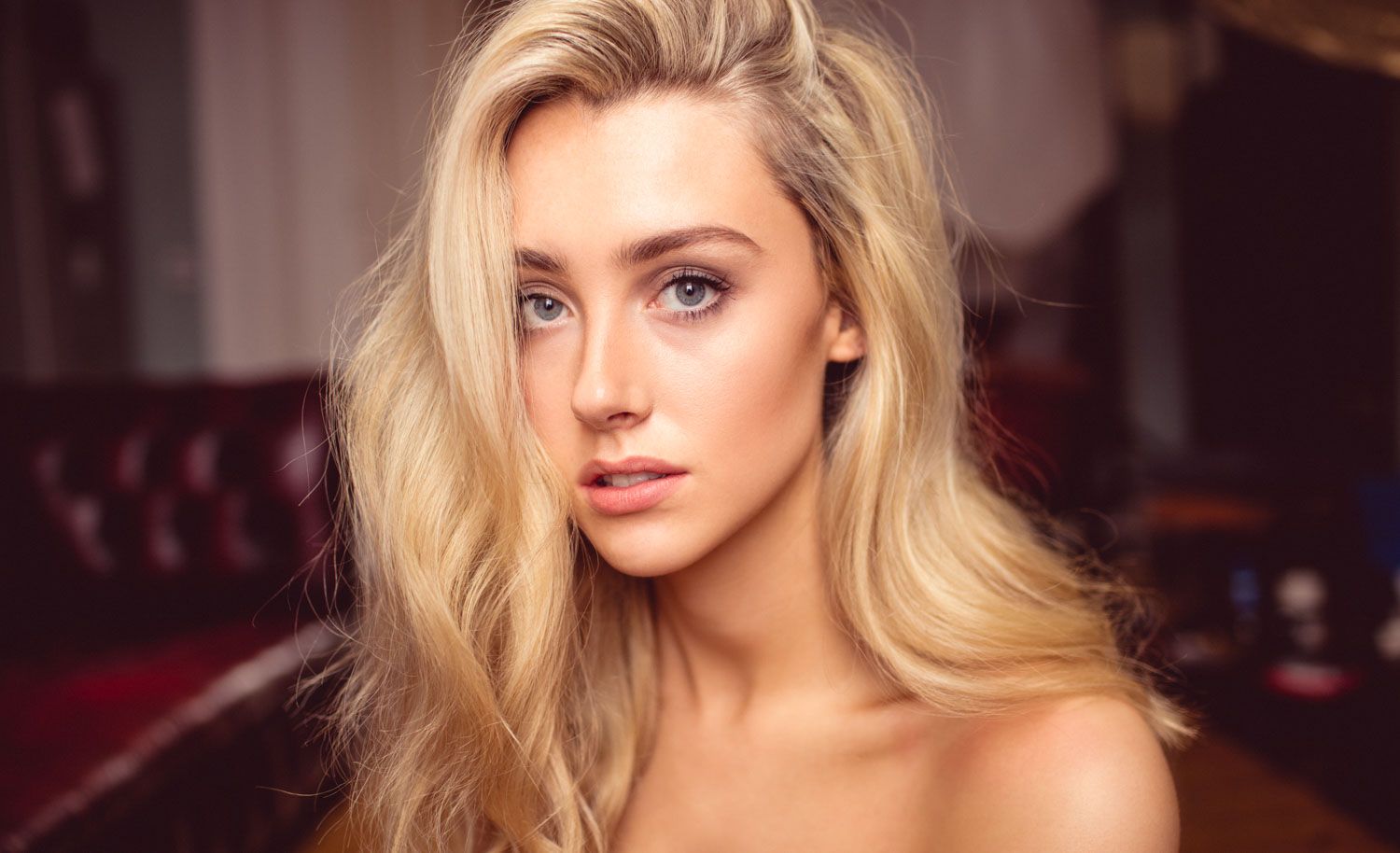 Female portrait highlighting facial features and expression, captured with soft natural light.