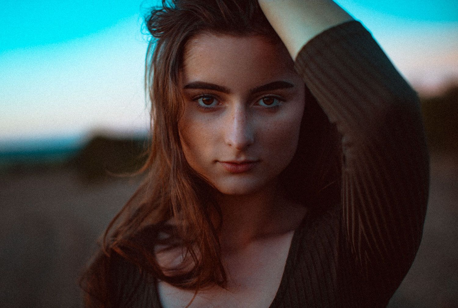 Artistic portrait of a woman in Cork, focusing on facial features and eye contact.