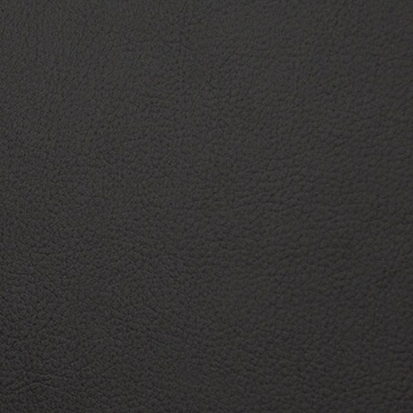 Dark textured background with grainy noise pattern showing rough black surface detail.