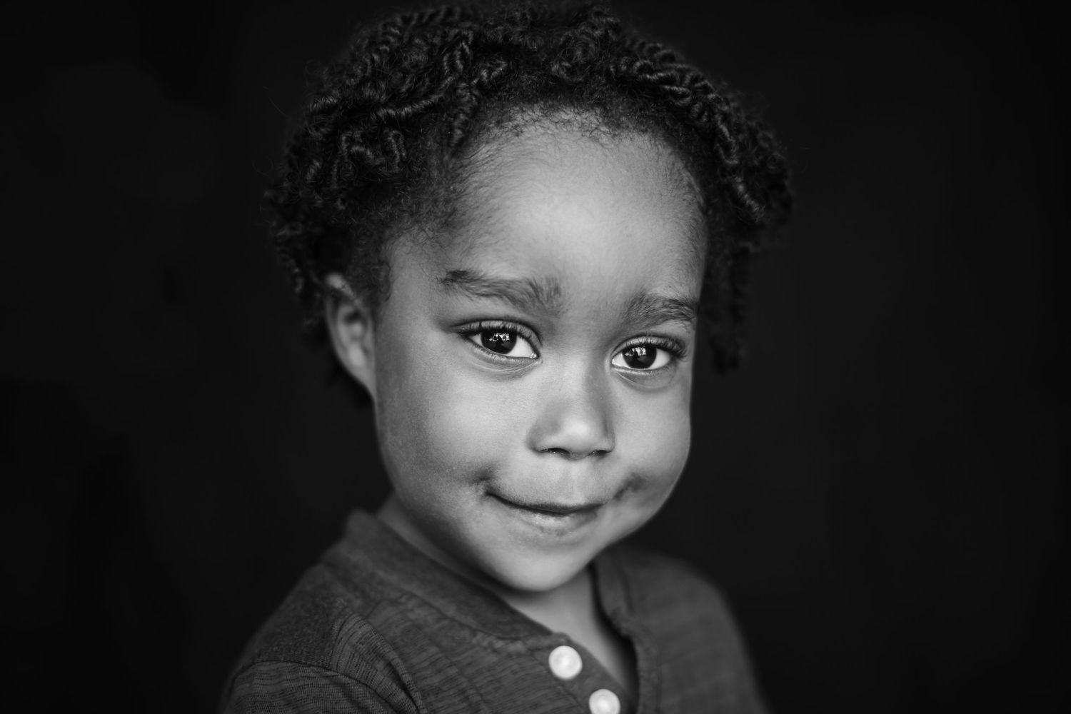 portrait of young black boy smiling