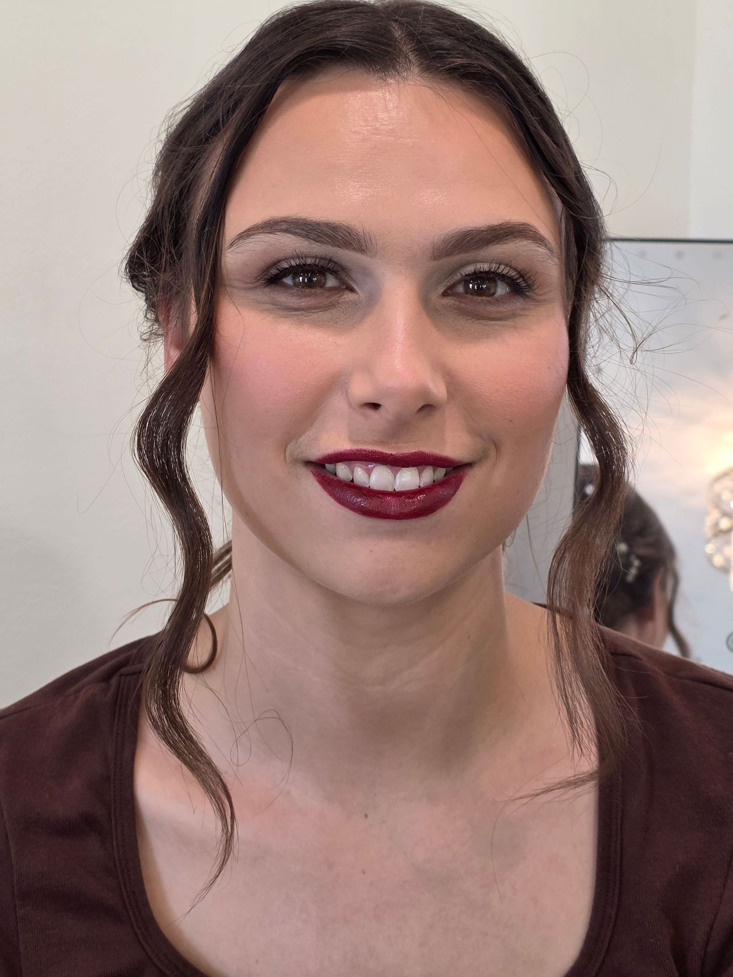 Series of beauty shots showcasing dark hair and burgundy lipstick makeup look.