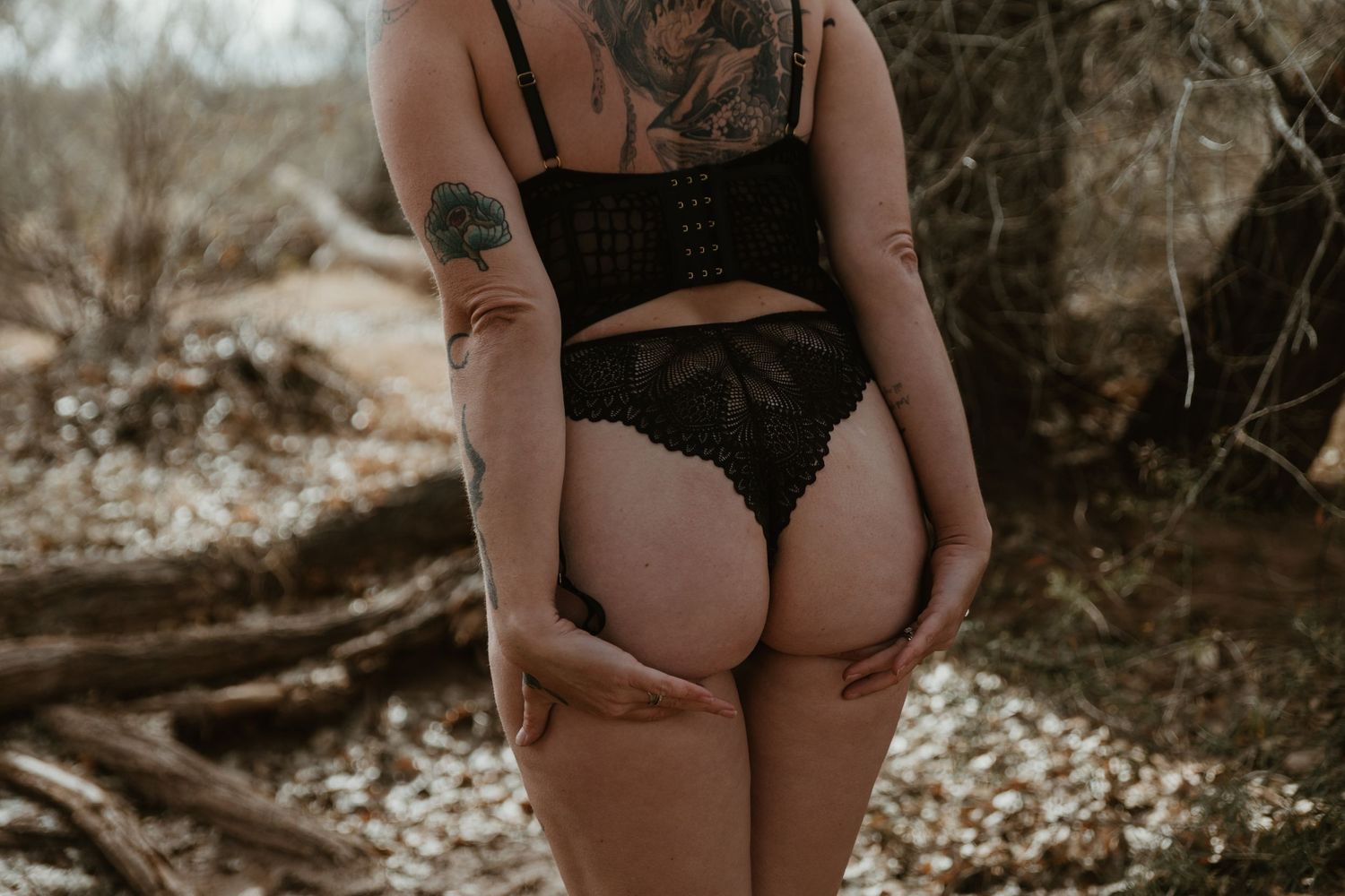 Intimate boudoir photo session featuring artistic black and white photography with soft lighting and delicate poses. Tucson boudoir.