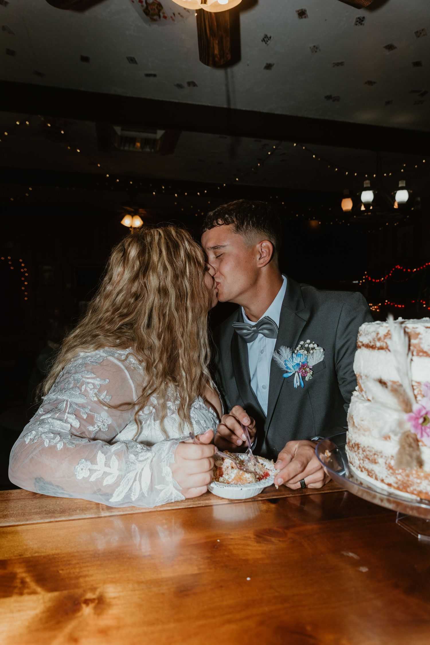 Couple playfully eating wedding cake together at reception table in sequence of progressive photos. Tucson Wedding photographer