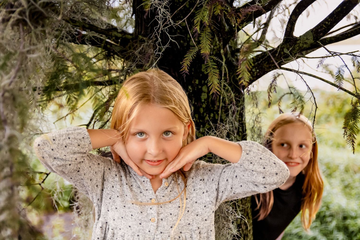 A person poses playfully in multiple outdoor shots against natural greenery and tree backgrounds.