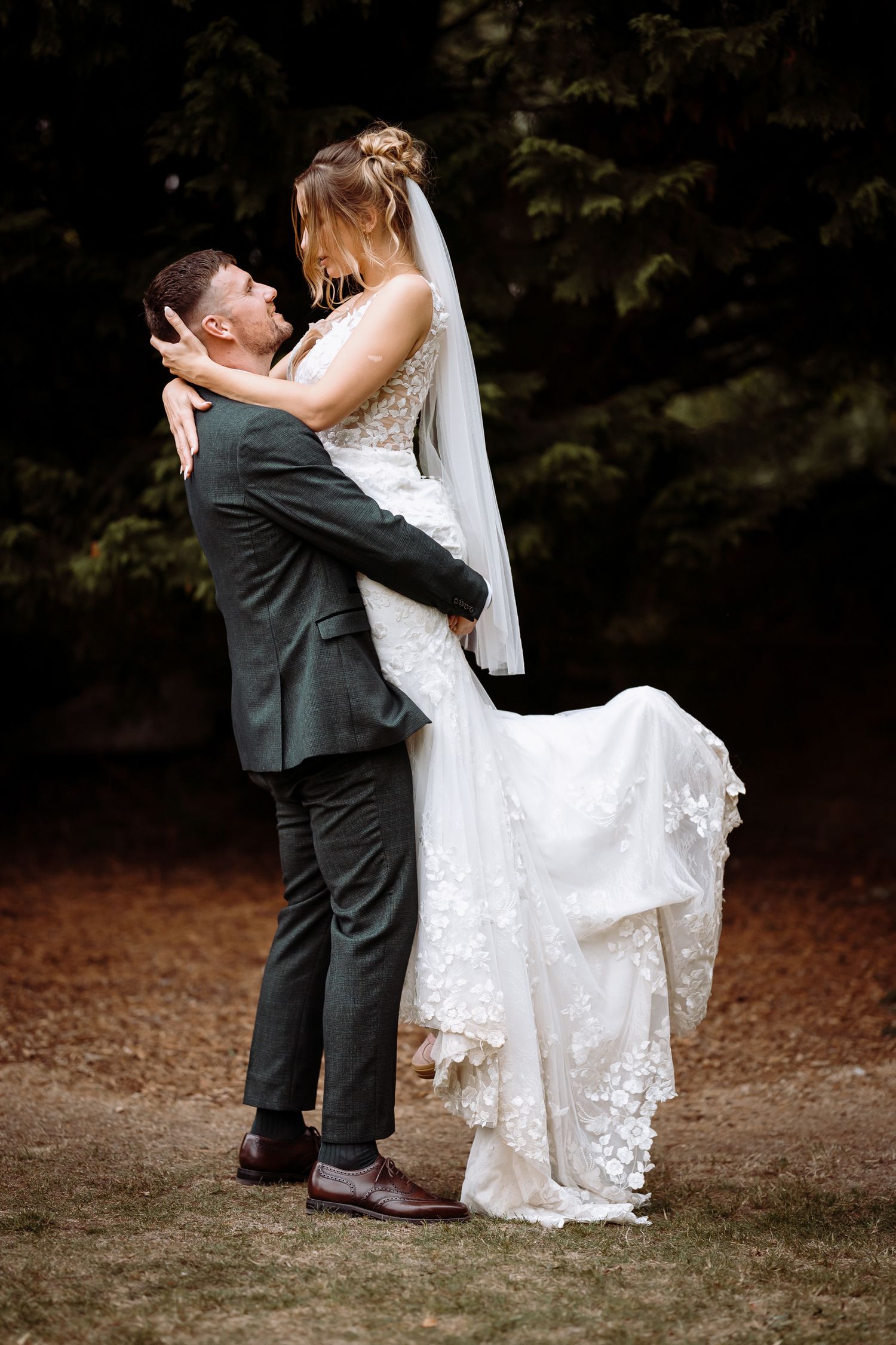 Beautiful natural wedding photo of a lift and twirl in Peterborough.