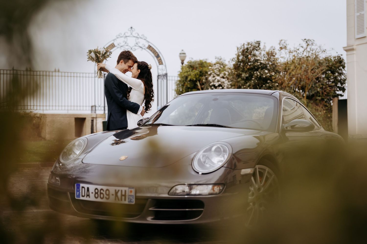 Luxury destination wedding photography featuring a sports car.