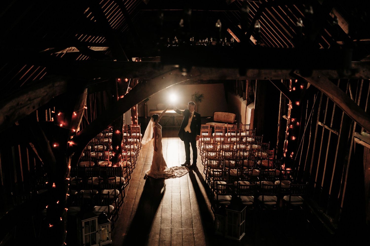 Natural documentary wedding photography of a ceremony in the Rickety Barn at Bassmead Manor Barns.