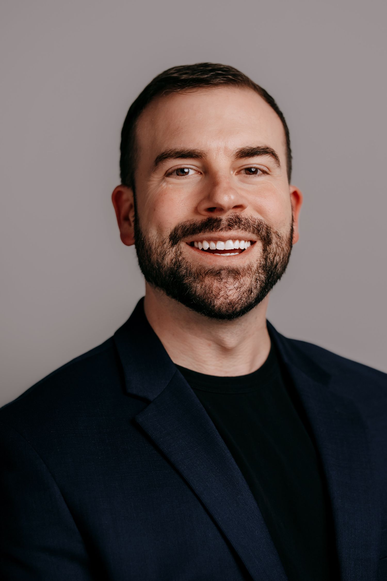 Relaxed and professional LinkedIn profile photo taken at a home studio in St Ives.
