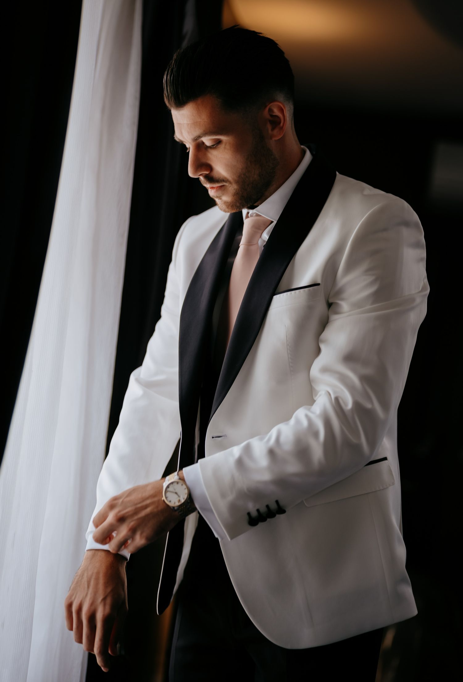 Groom portrait by a window at Swynford Manor, Newmarket.