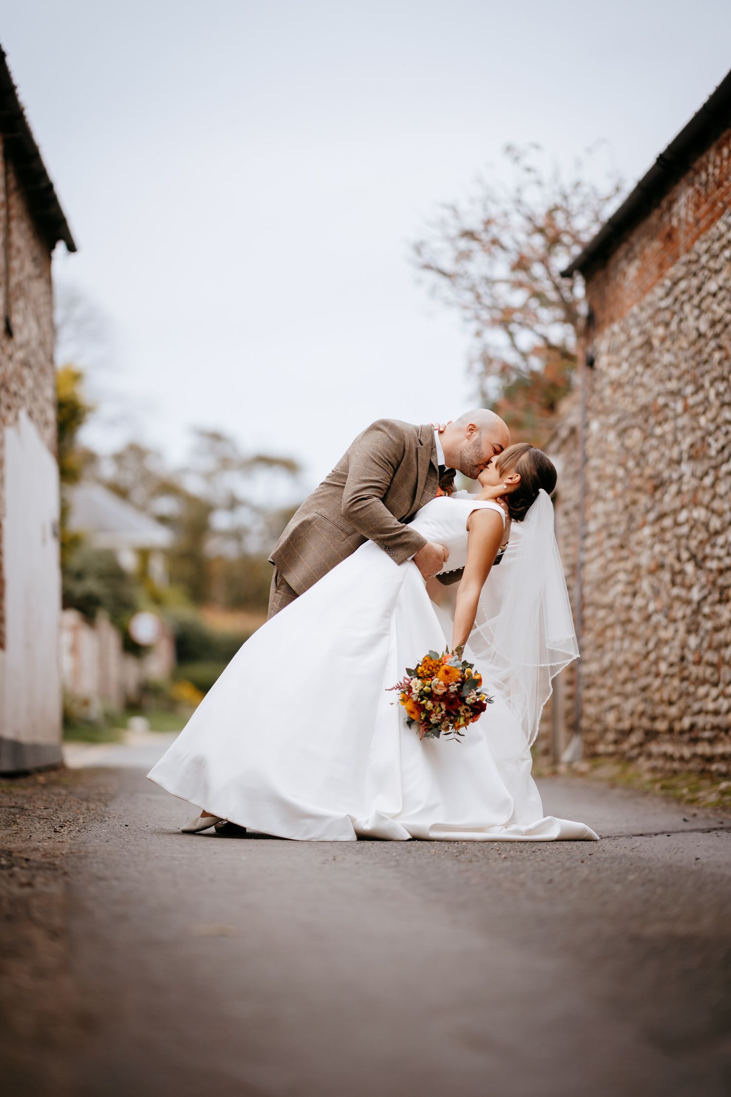 Romantic wedding dip pose in Burnham Market.