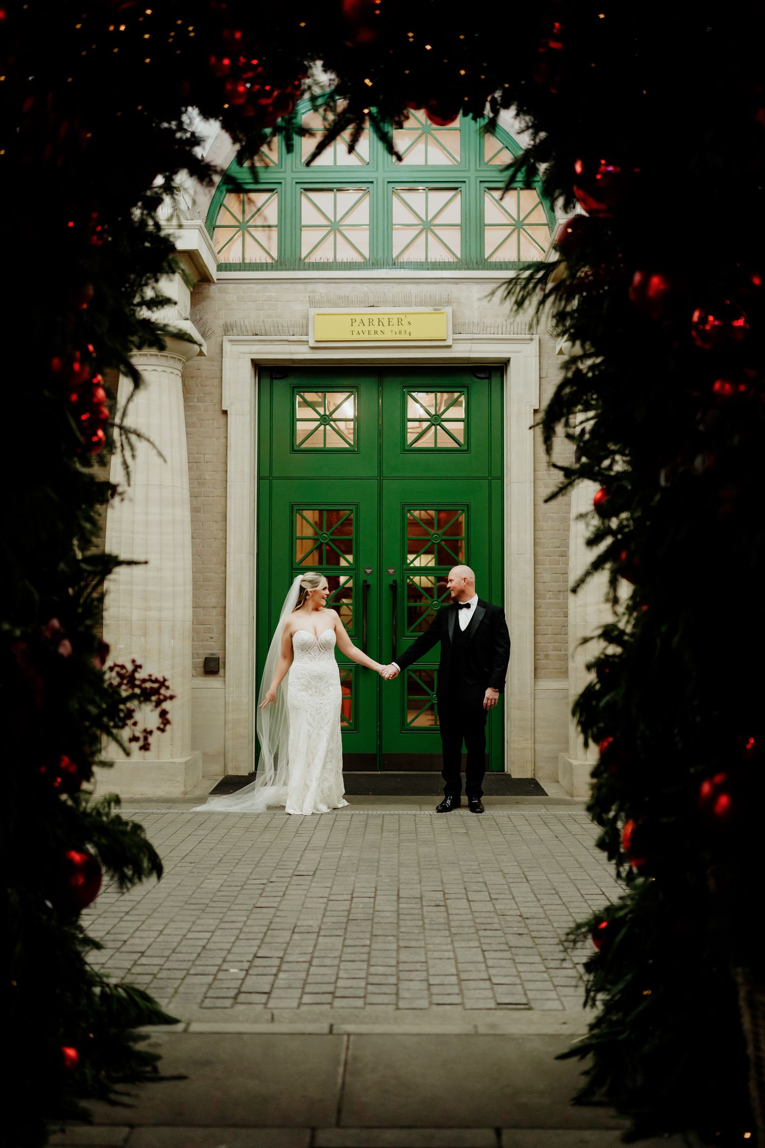Entrance photo at University Arms Cambridge wedding during Christmas.