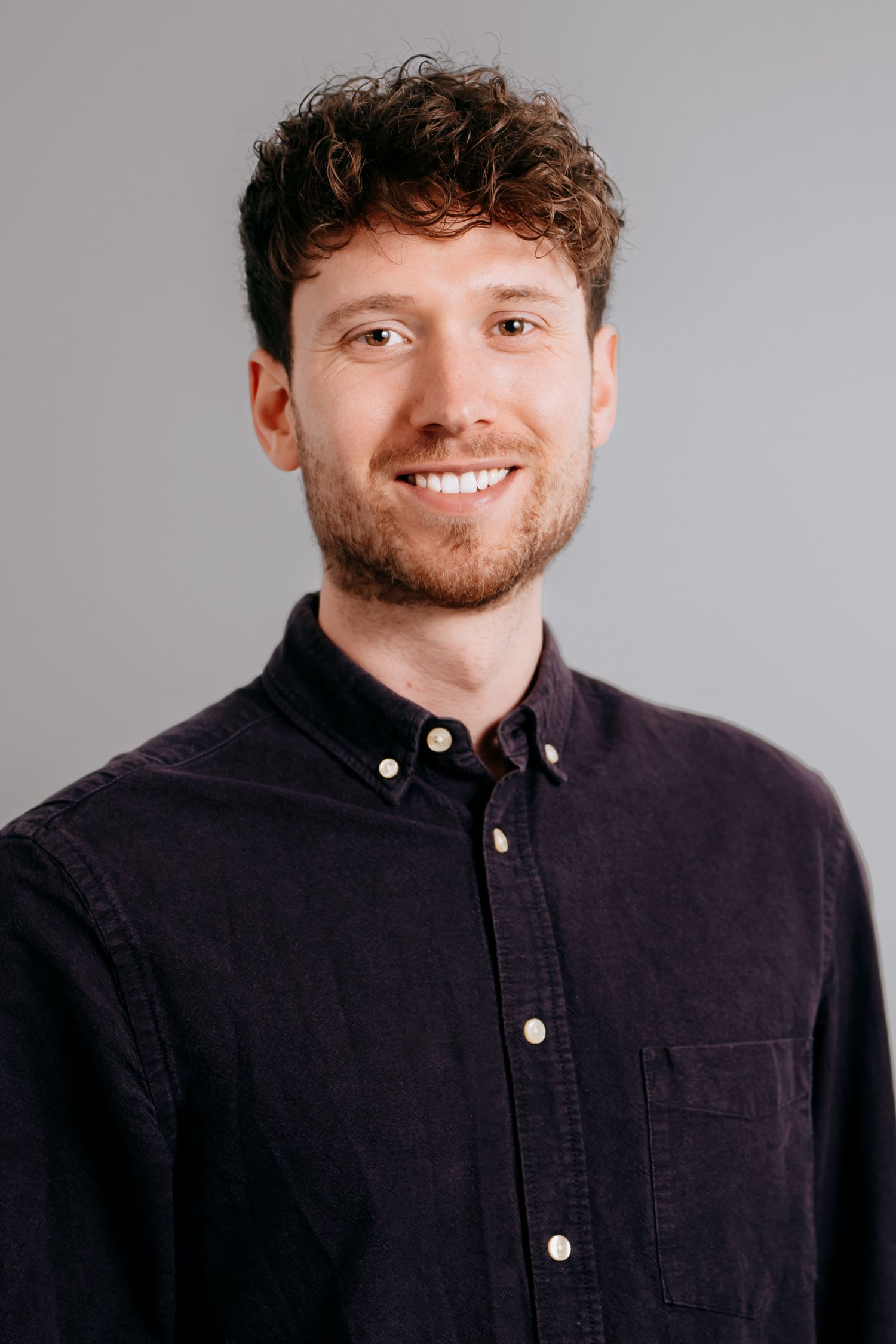 Creative business owner portrait in a Cambridge studio setting.