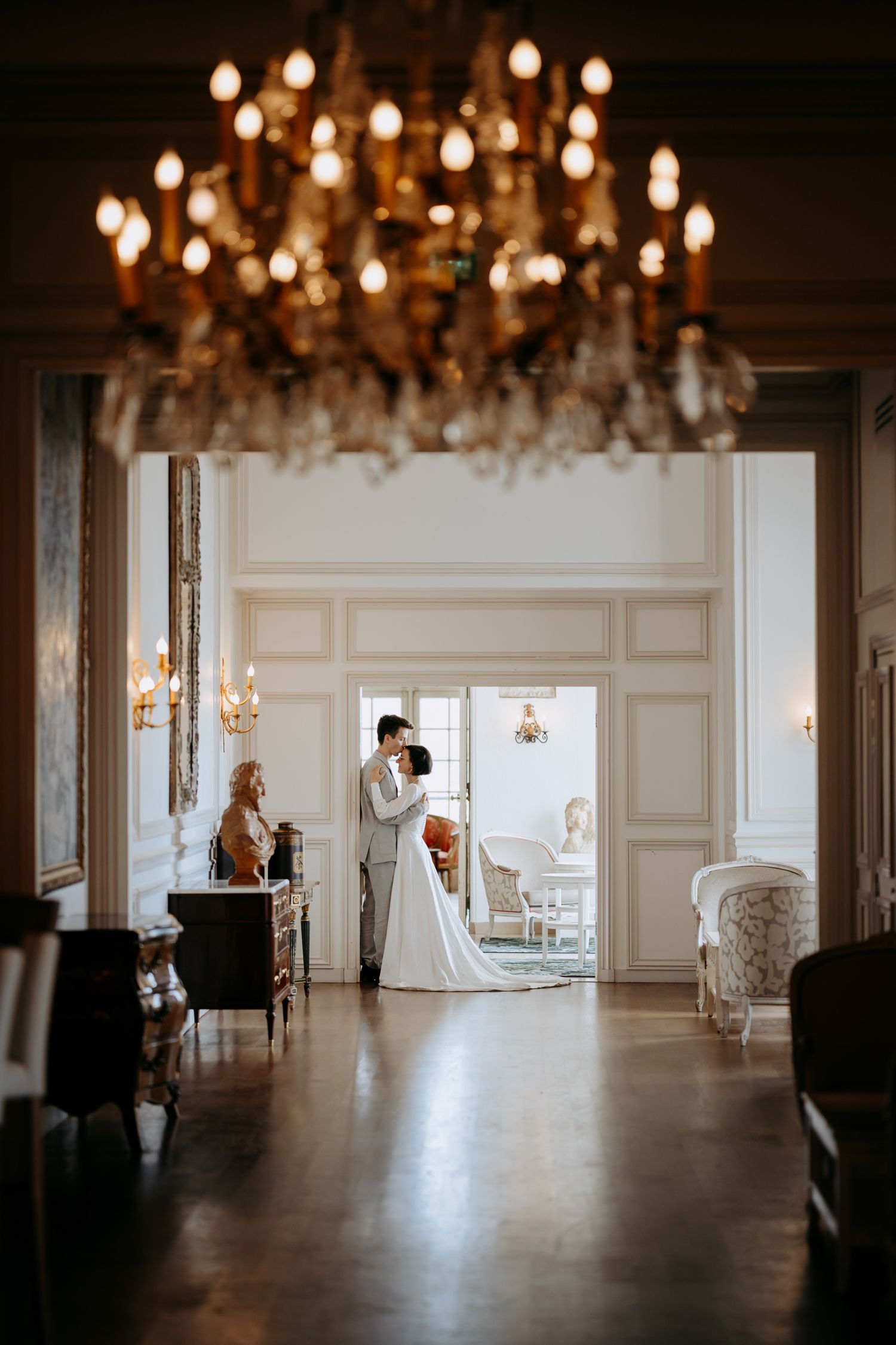 Destination wedding in Paris with natural light in a grand hall.