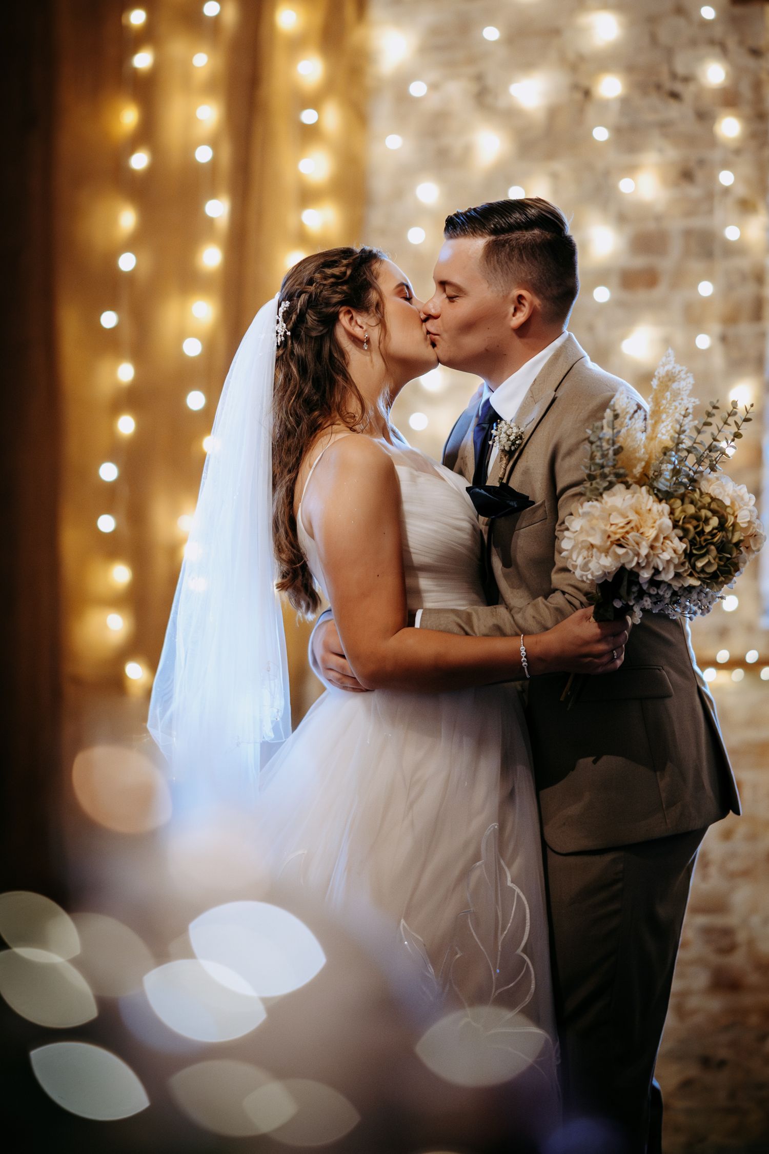 Low-light barn couple portraits with fairy lights in St Ives.