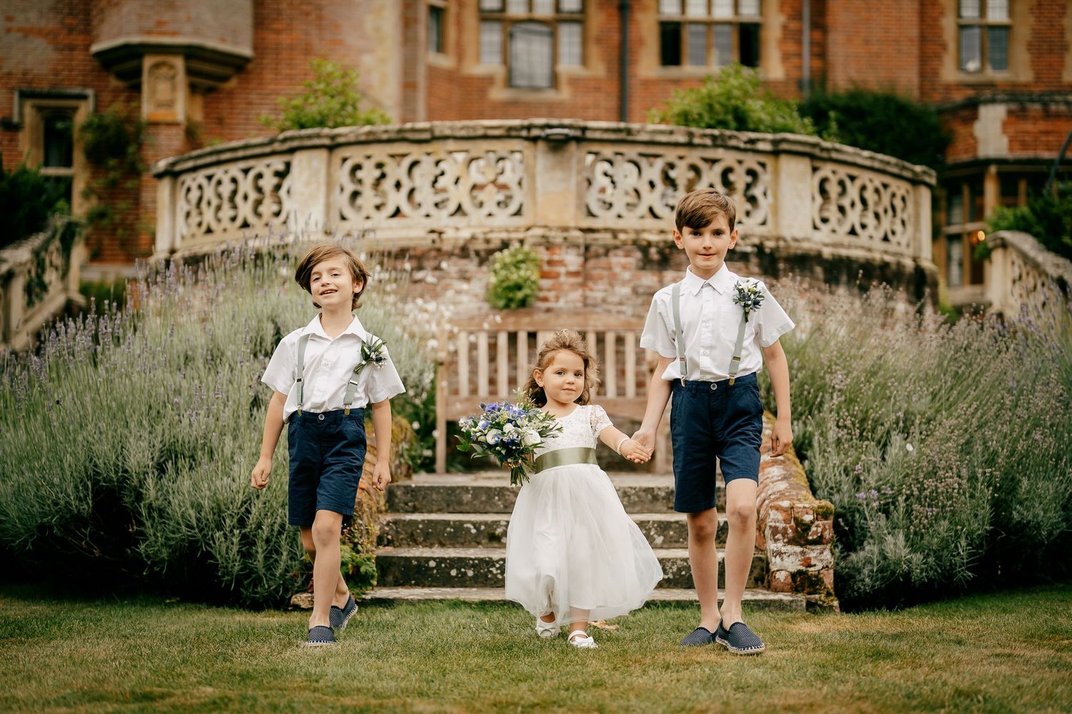 Outdoor ceremony photos on the steps to the sunken garden at Lanwades Hall.