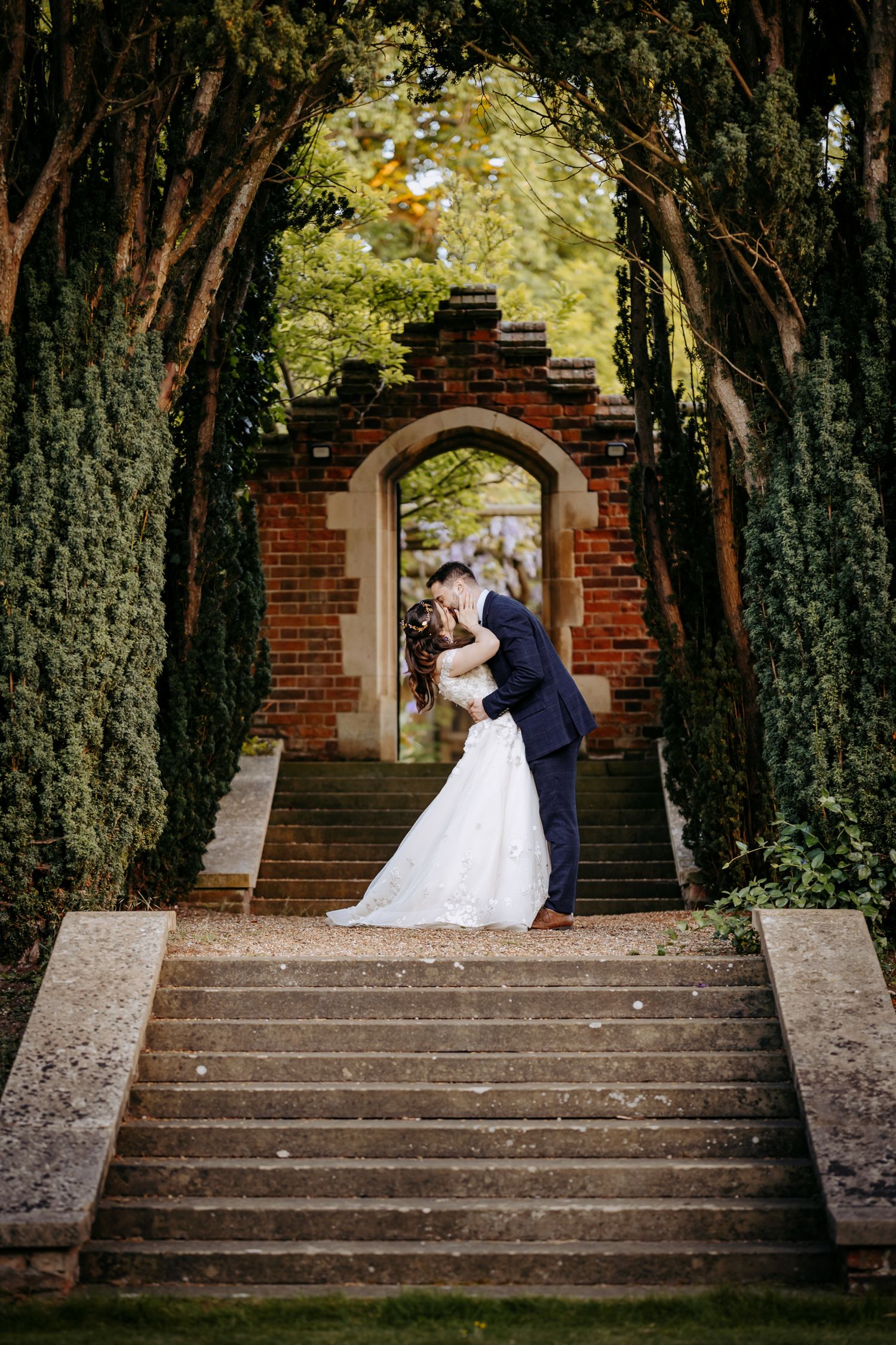 Wedding photo on the steps at Lanwades Hall in Newmarket.