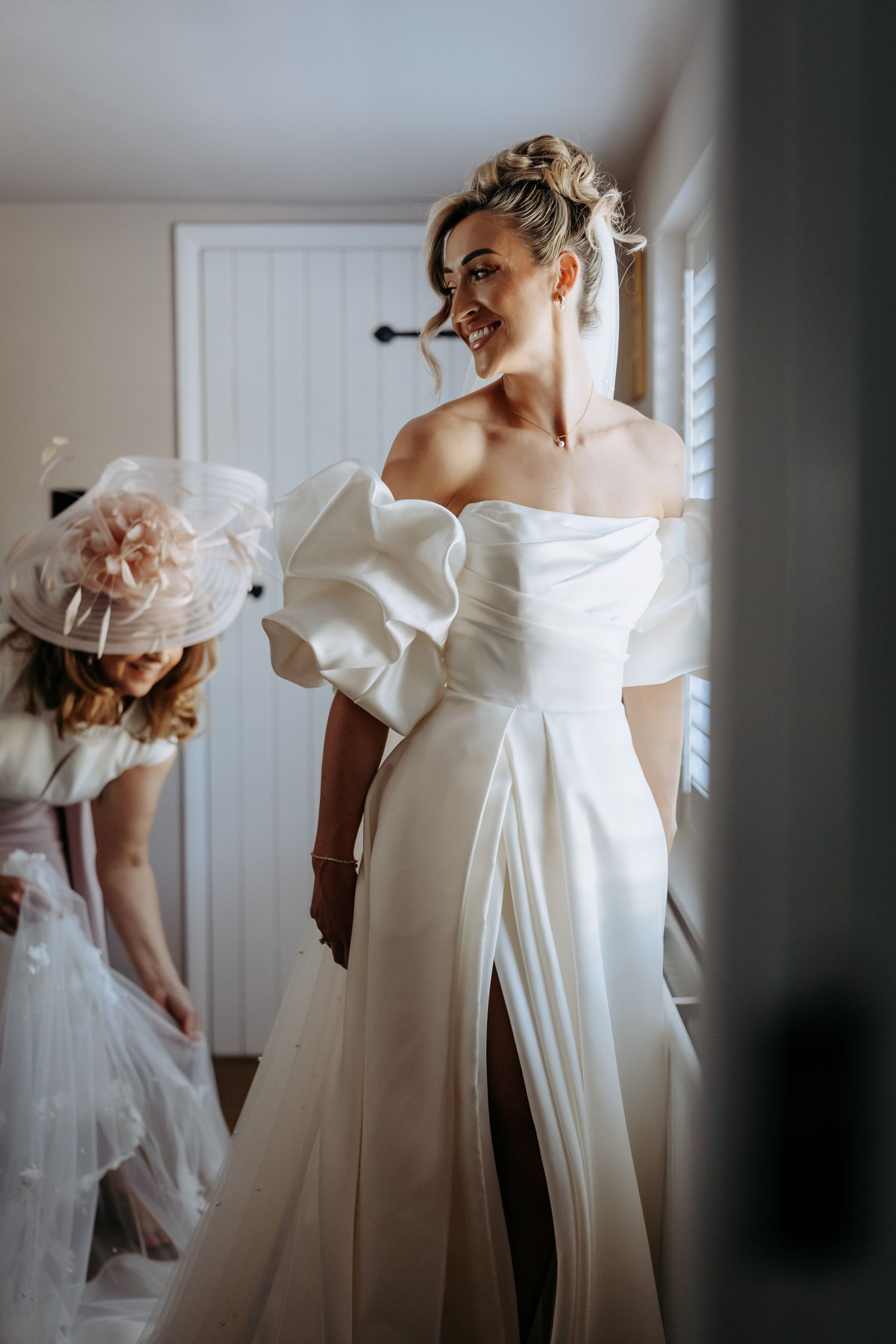 Mother and bride preparation for a church wedding in Cambridge.