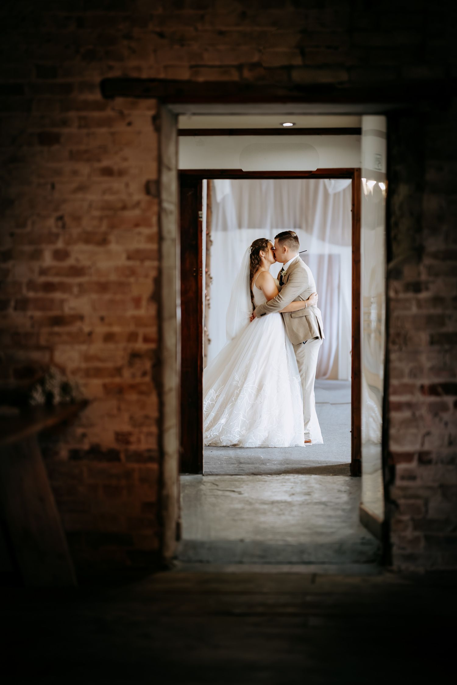 Couple in a rustic barn wedding photography session in St Ives, Cambridgeshire.