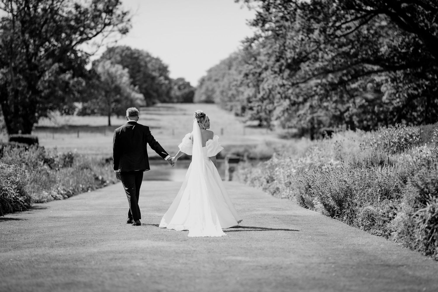 Candid wedding photo capturing a moment via a mirror reflection.