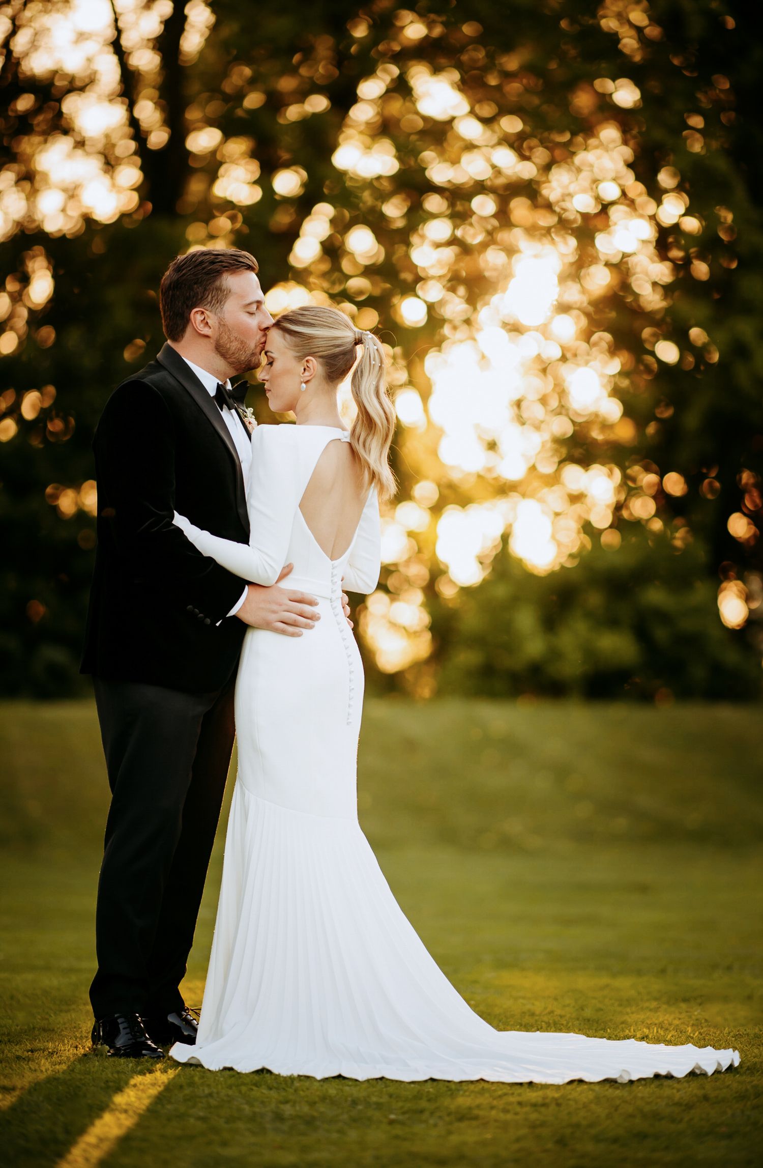 Simple posing idea, kiss on the head, during a Cambridge wedding.