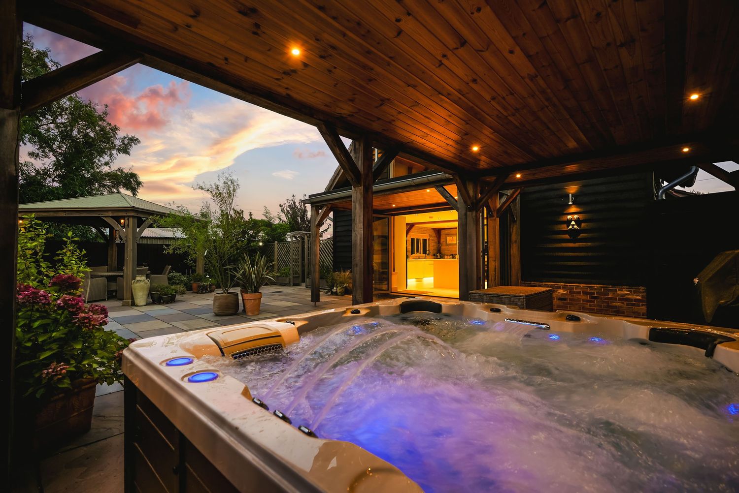 Lifestyle property photography featuring a hot tub at sunset.