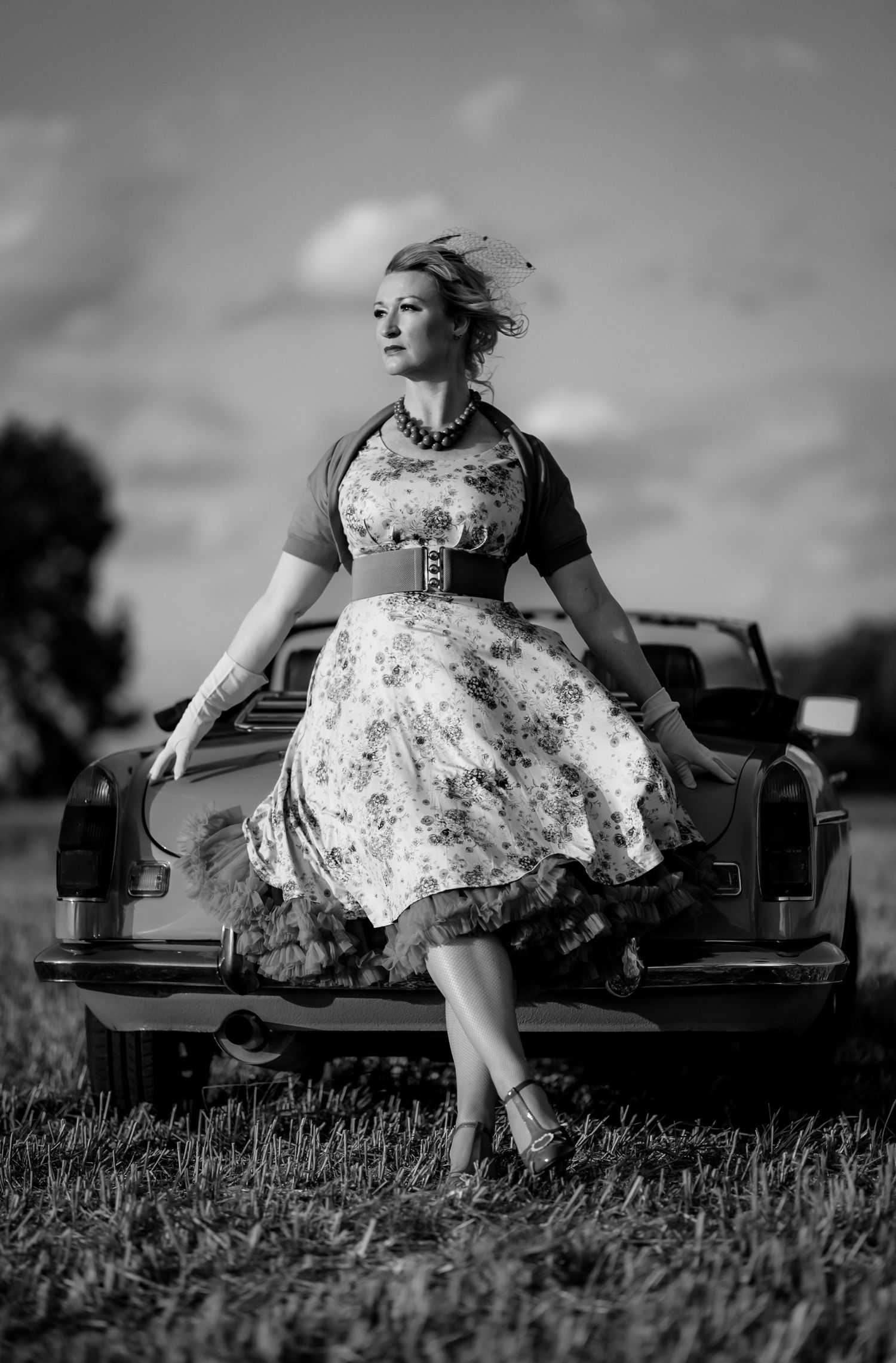 Artistic black and white portrait photography session with a vintage car in Cambridgeshire.
