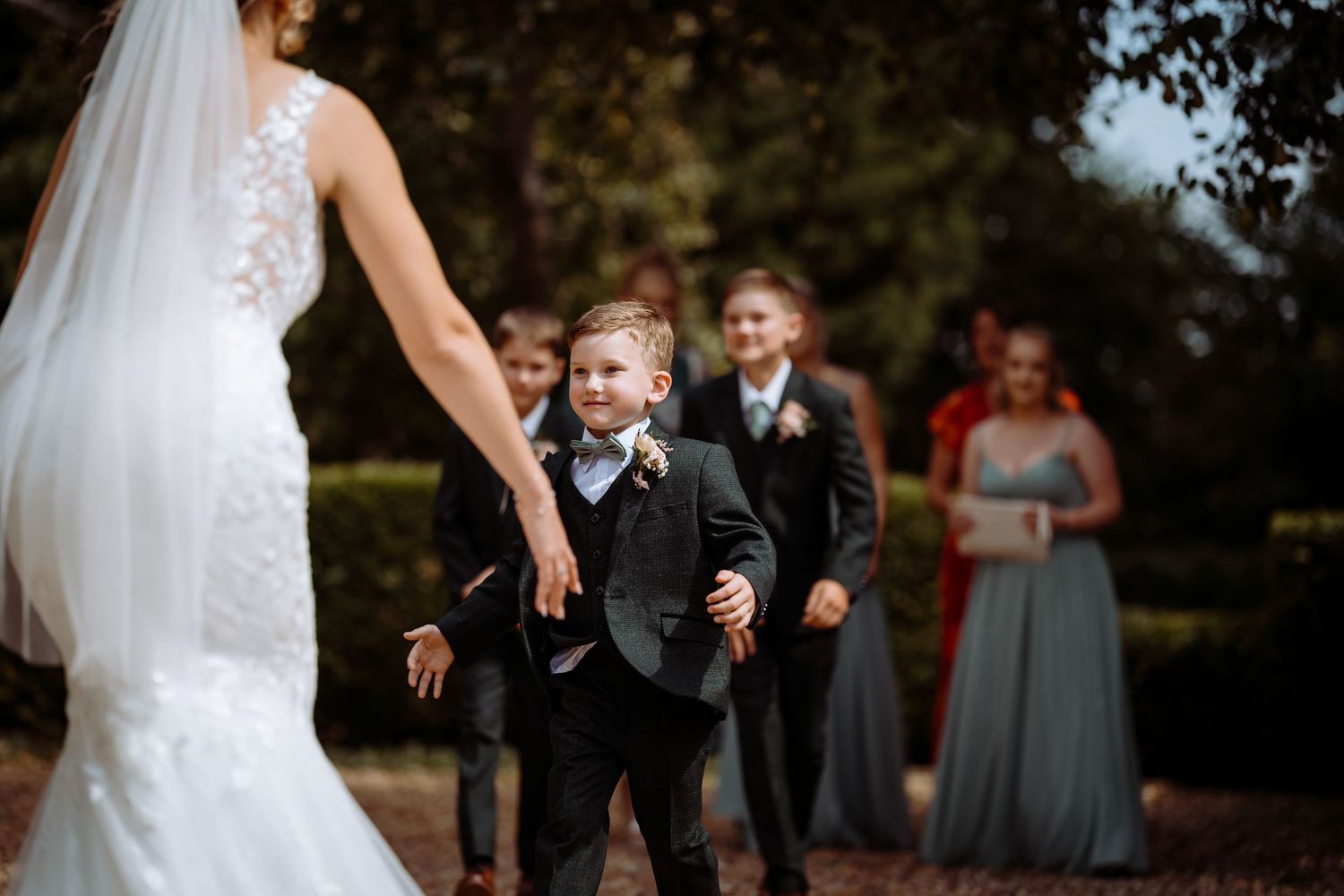Kids seeing mum for first time in her dress. Beautiful wedding candid moment captured at Longstowe Hall, Cambridge.