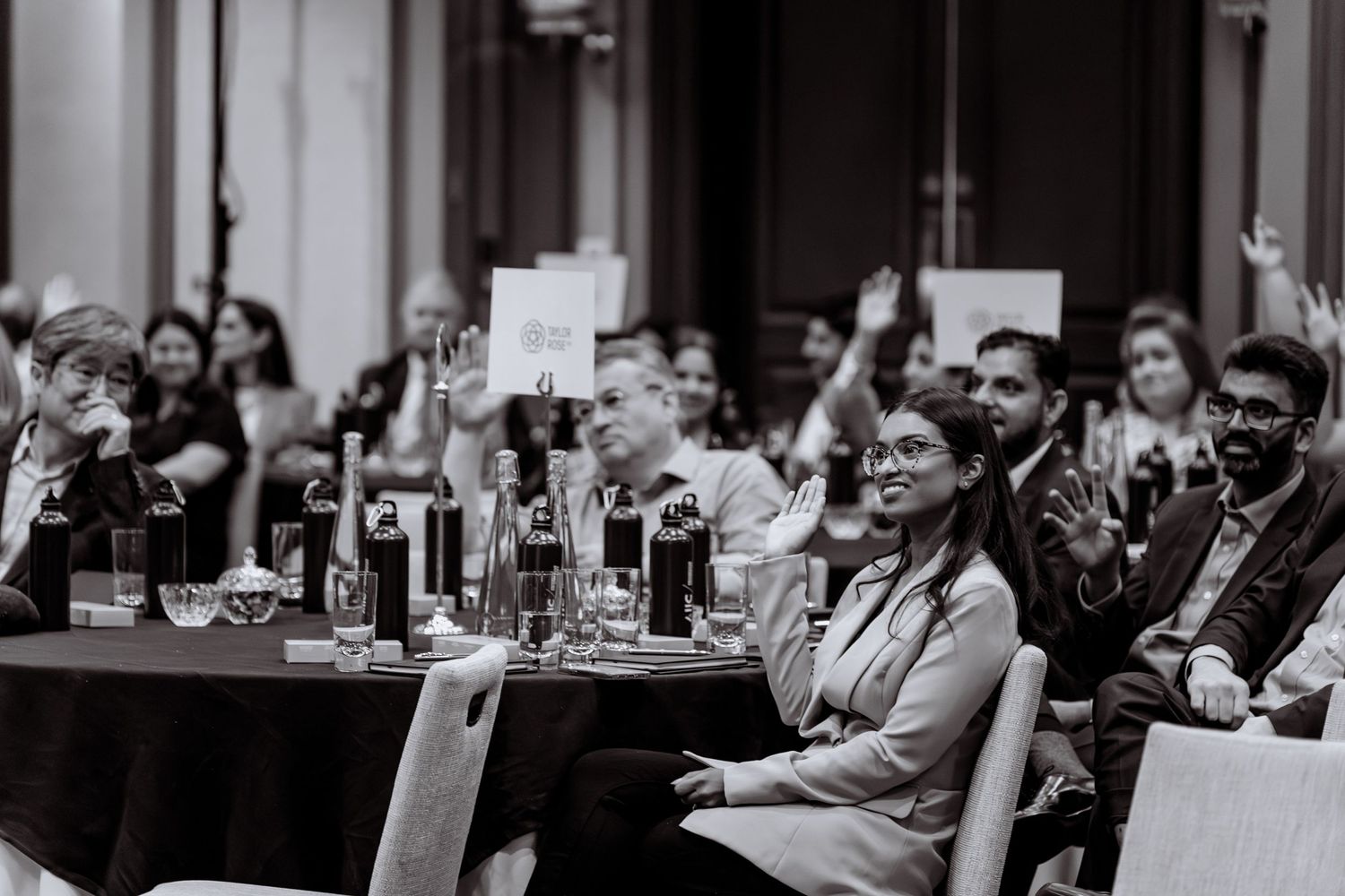 Black and white event photography of an engaged audience at a conference.