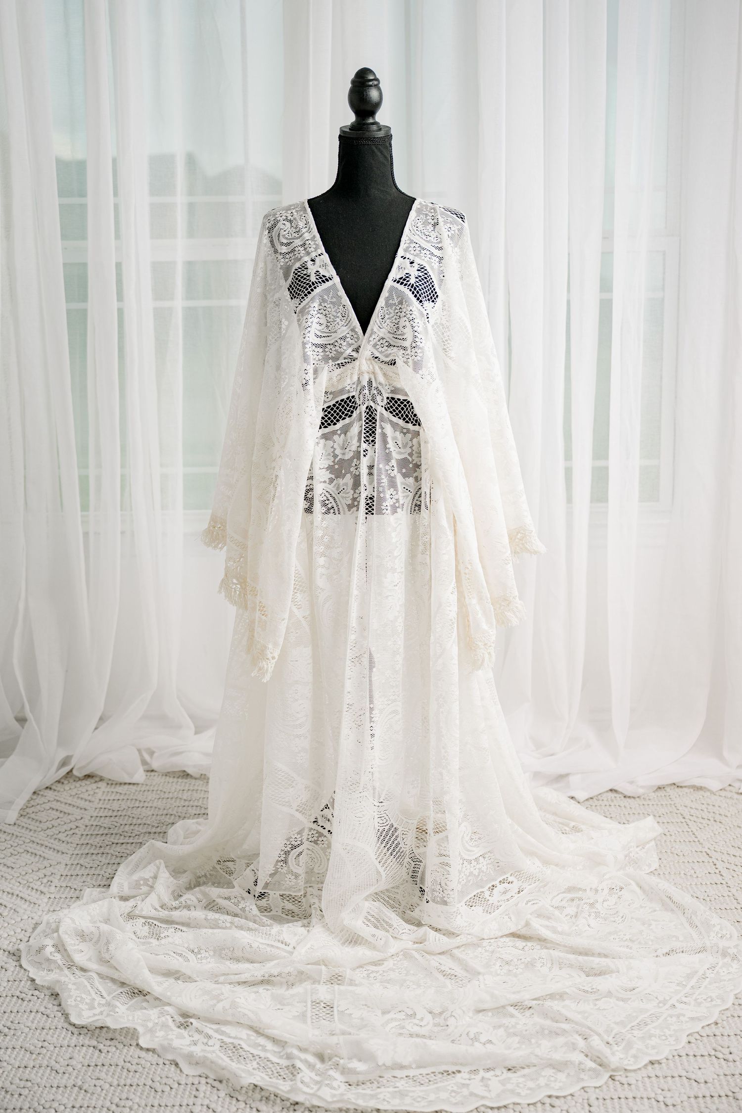 Ivory boho lace kimono sleeve open-front maxi robe on black mannequin.